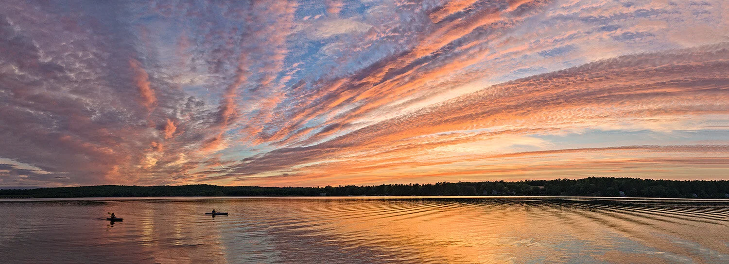  Panorama sunset with kayakers on Taylor Pond, Auburn, Maine. 