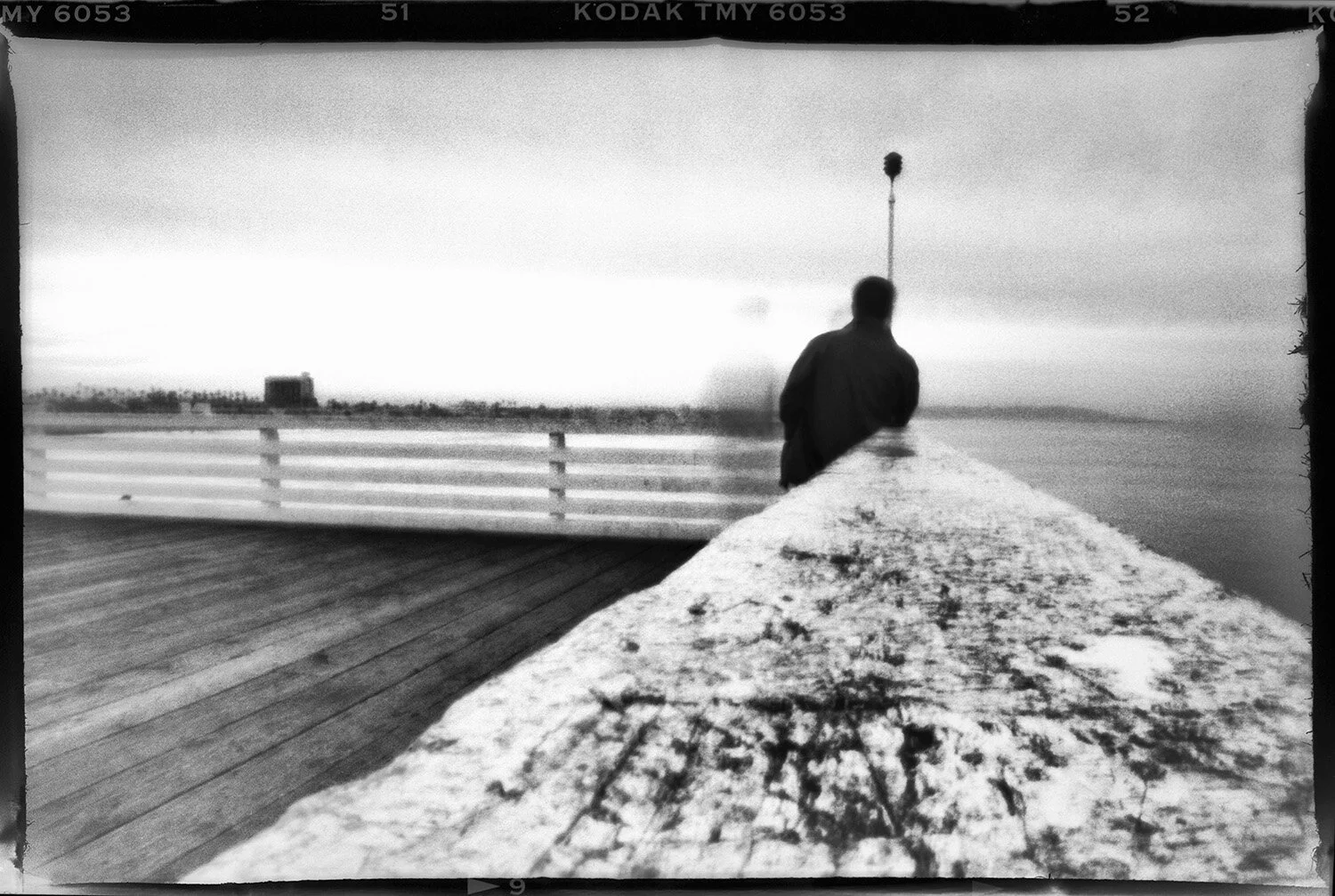  Medium Format pinhole photograph of lone figure on pier in San Diego, CA. 