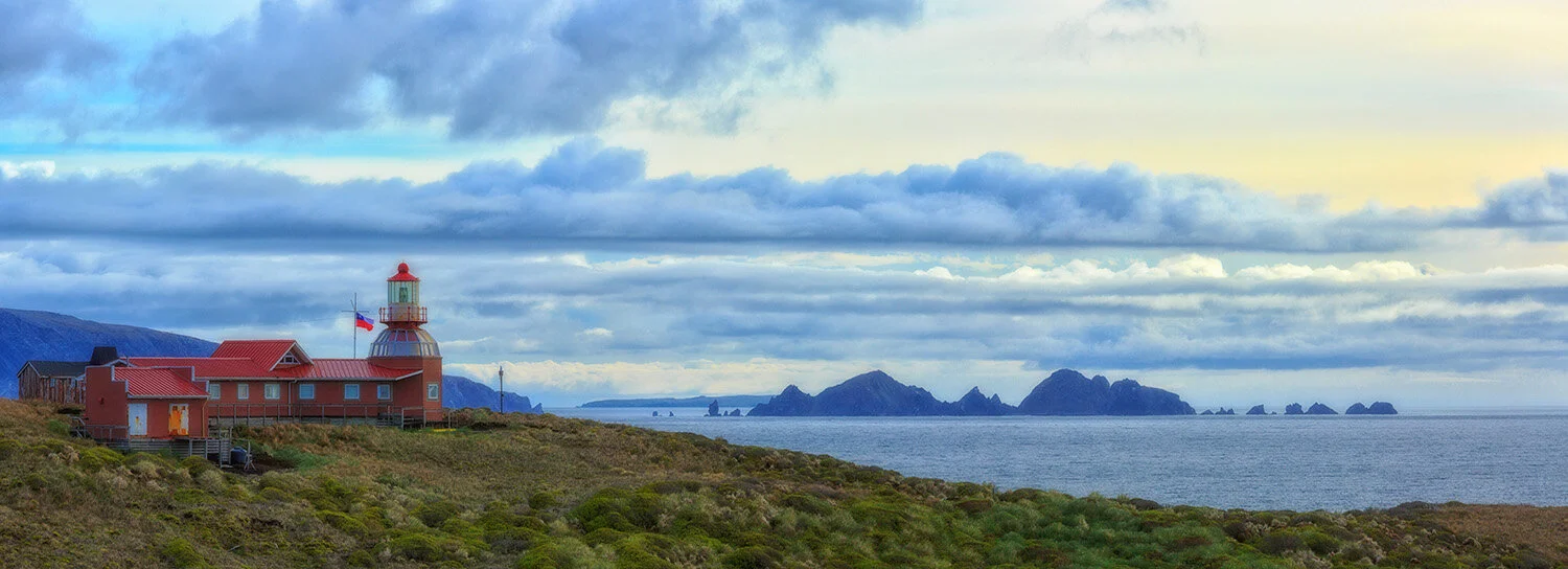  Panorama of Cape Horn Lighthouse in Tierra del Fuego, Patagonian Chile as it faces the Drake Passage, roughest waters in the world. 