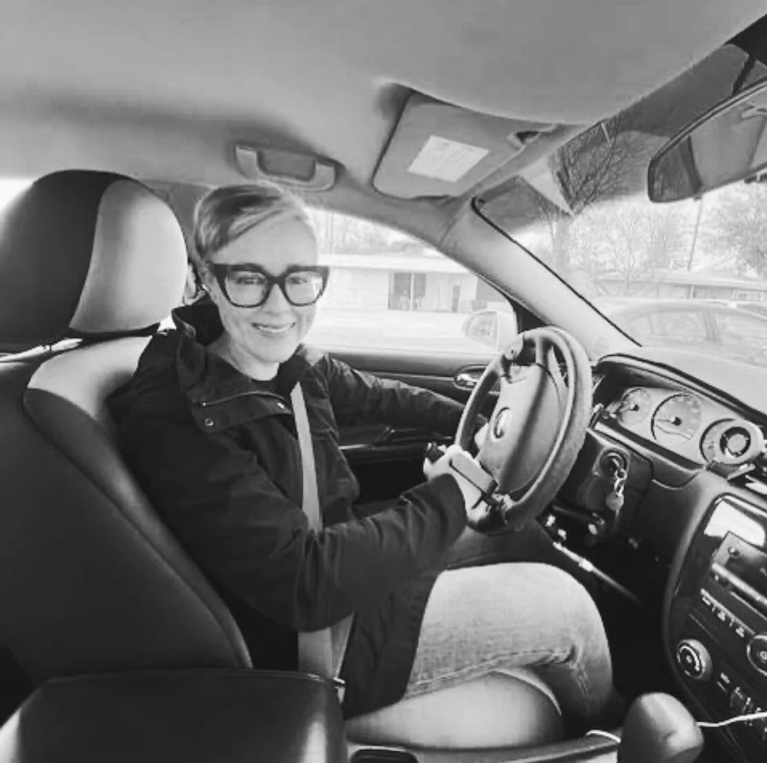 Liz Salmi behind the wheel thanks to hand controls.
