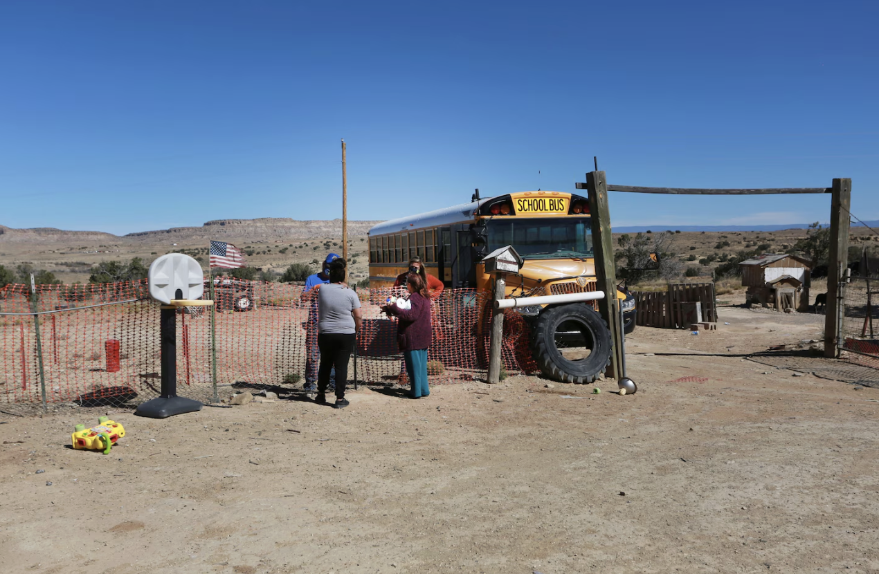 A social worker delivers supplies she collected at Cuba High School along a rural school bus route in 2020. Cuba Independent School District participated in a pilot project to give homeless students $500 a month to stay in school.