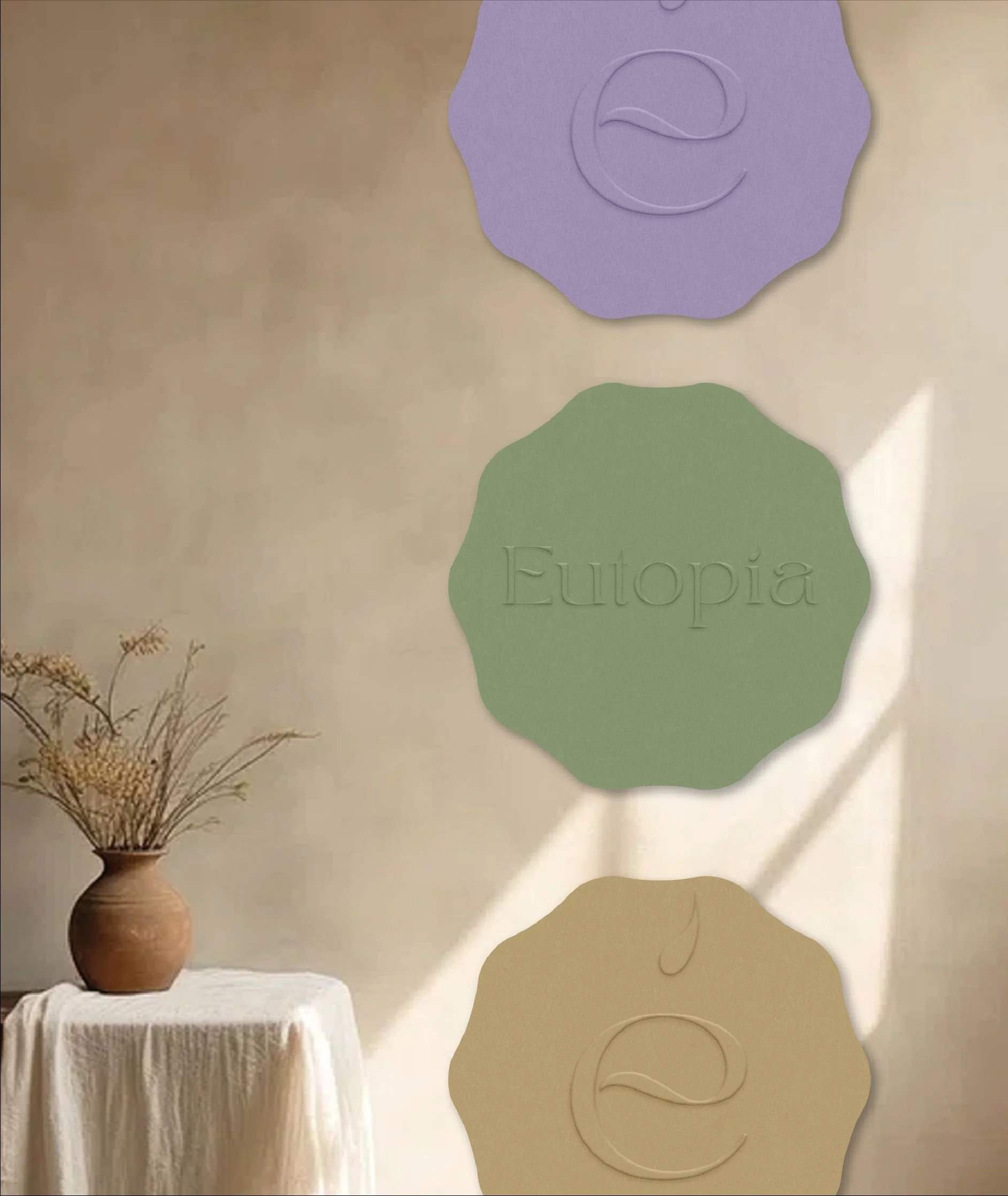 Branding mockups for Eutopía, highlighting Branding Kit and 1:1 Mentoring applied to handcrafted products for peaceful home living