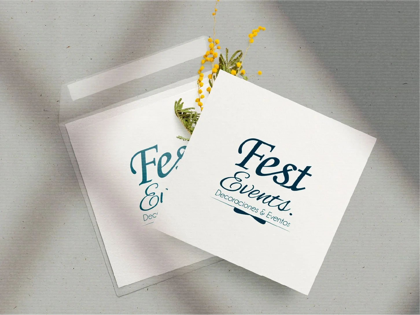 Elegant branded stationery with floral accents on a neutral background.