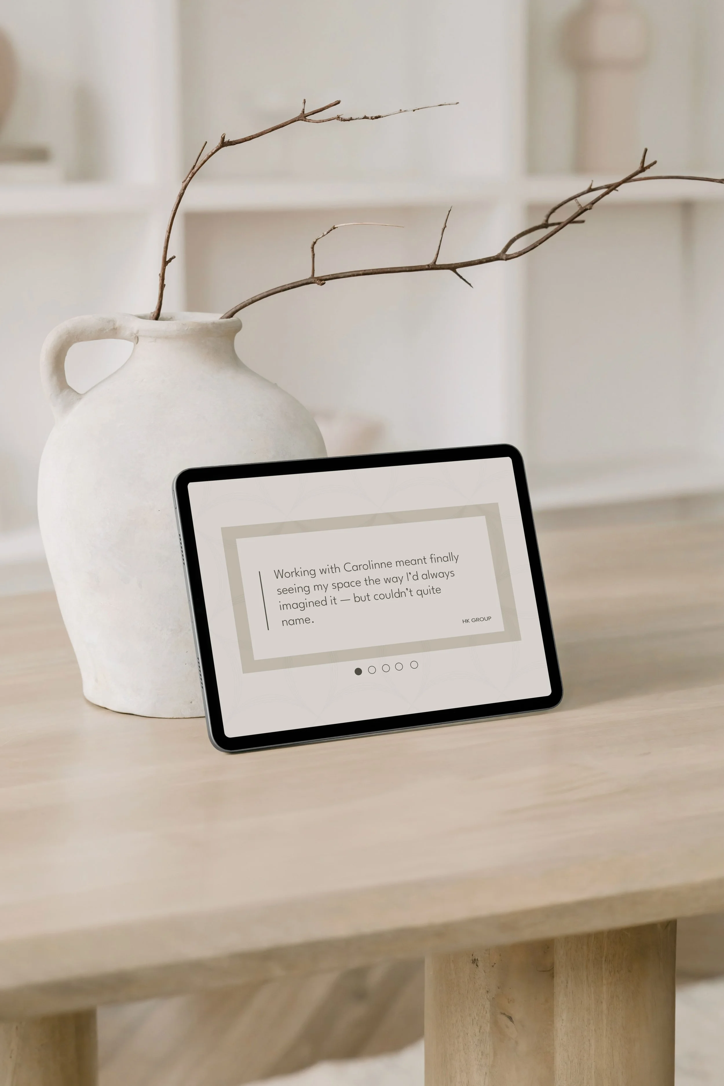 Tablet displaying a client testimonial for Carolinne Altrum.
