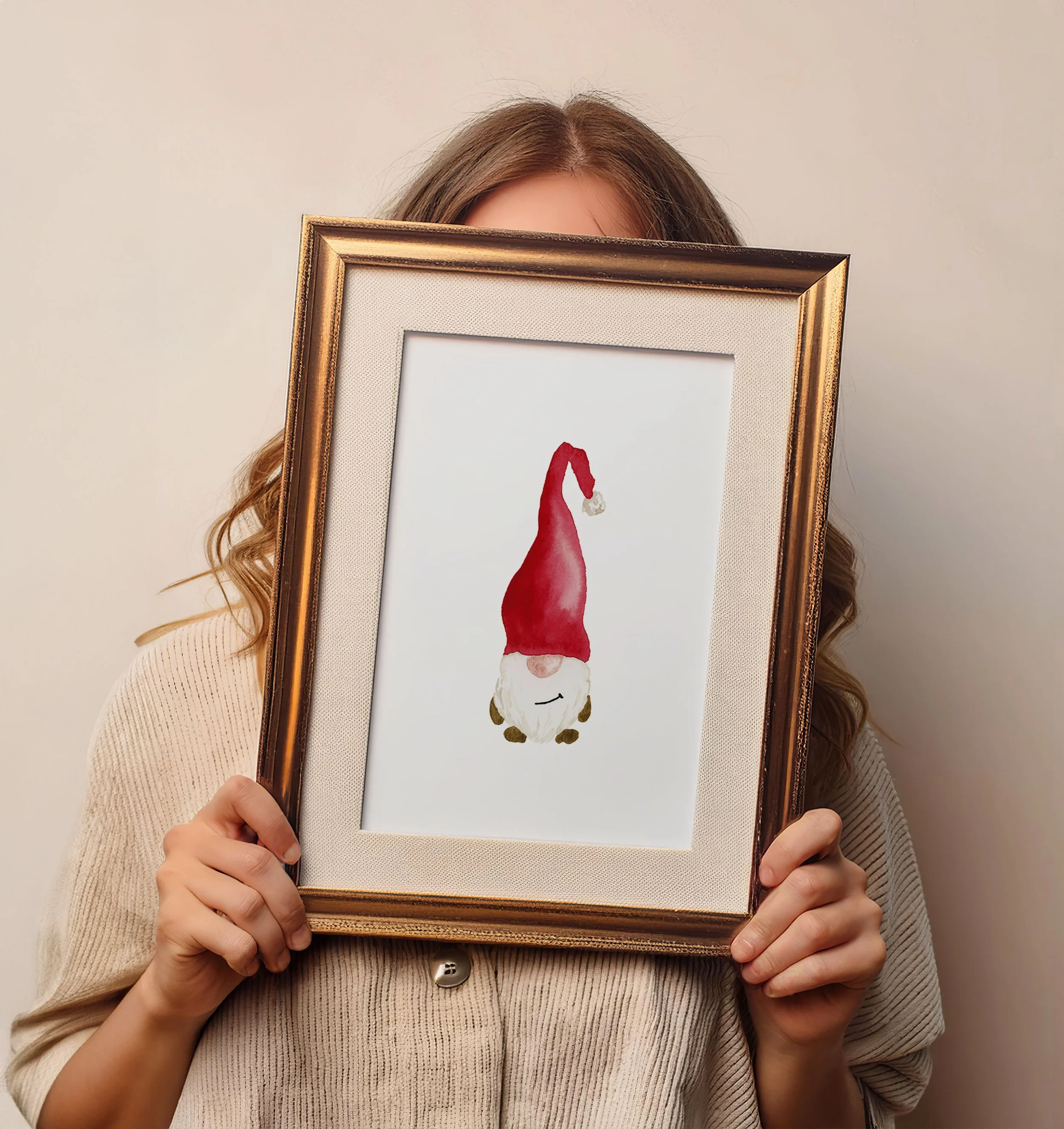 Person holding a framed holiday-themed illustration of a gnome with a tall red hat and white beard