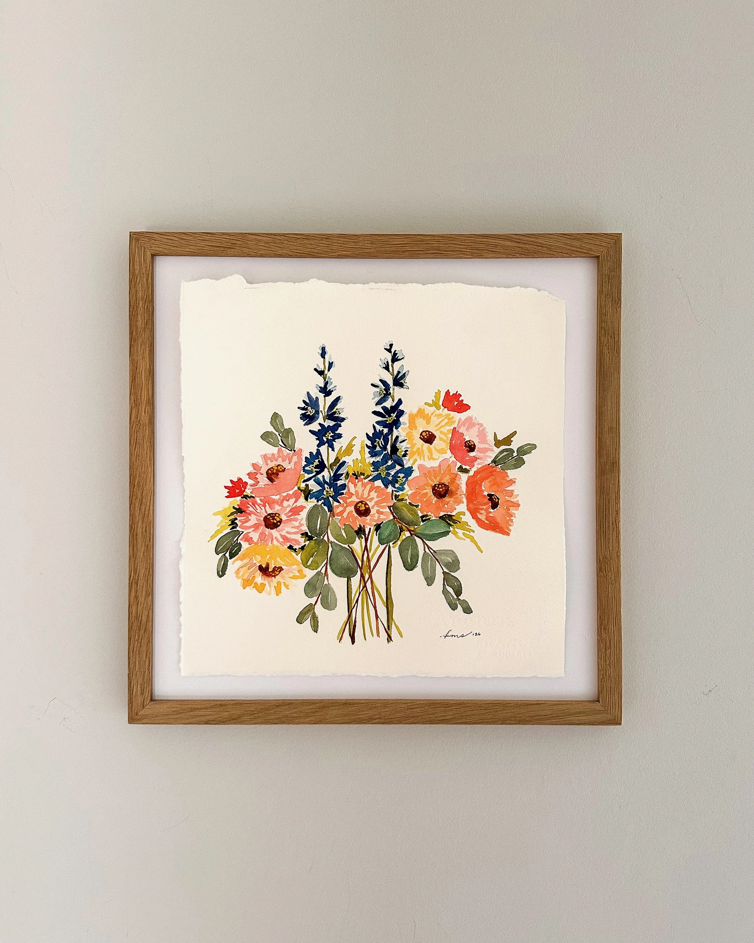 joyful garden bouquet framed in oak on wall.jpeg