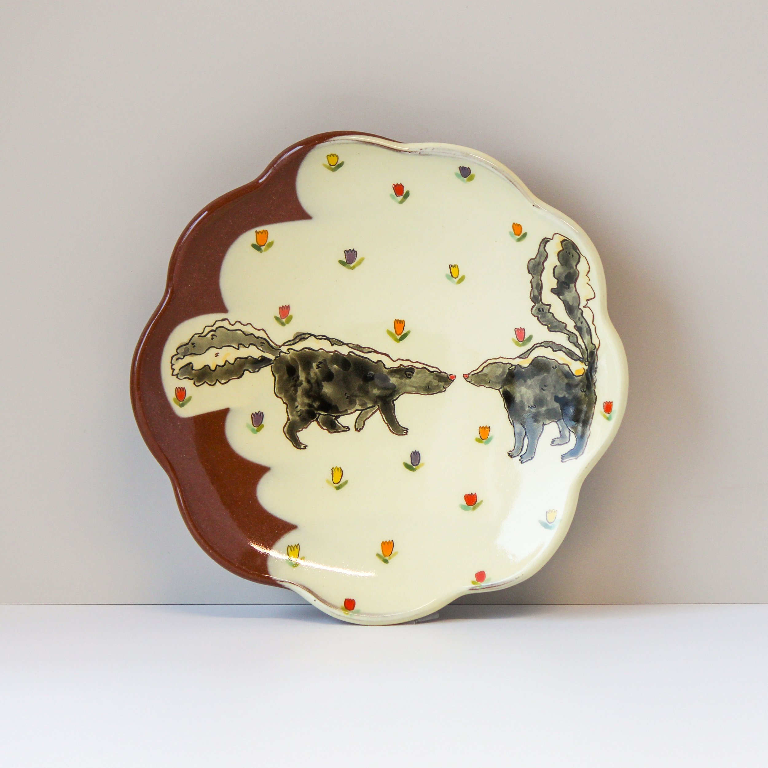 skunks scalloped plate.jpg