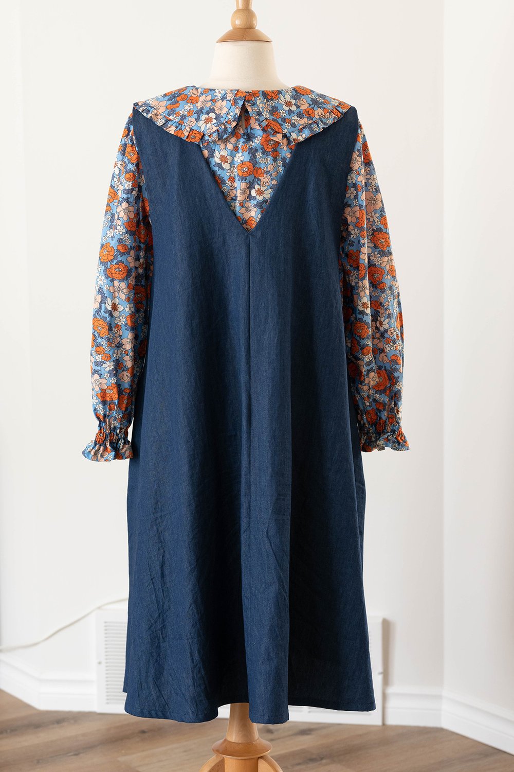 Denim pinafore and a floral top with big collars