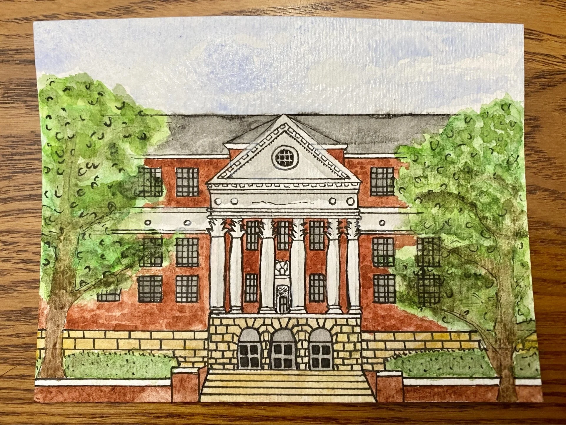 A watercolor painting of a university building for a custom greeting card