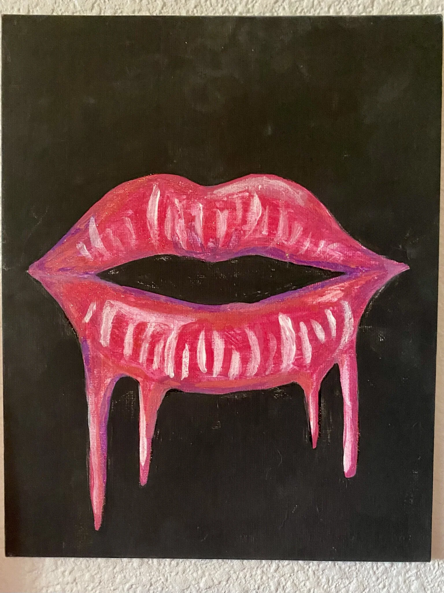 A painting I did of hot pink lips on black - tempera and acrylic paint on canvas