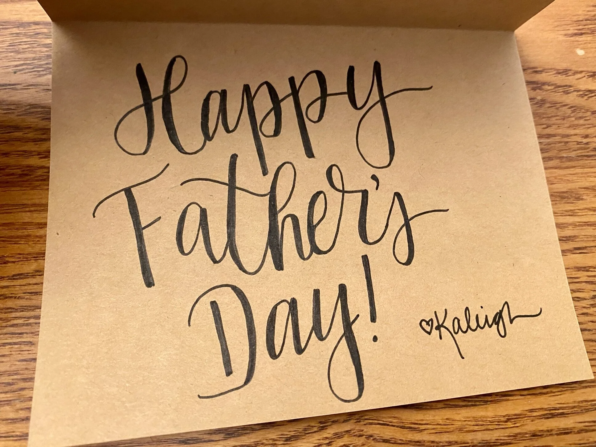 A Father's Day card featuring hand lettering