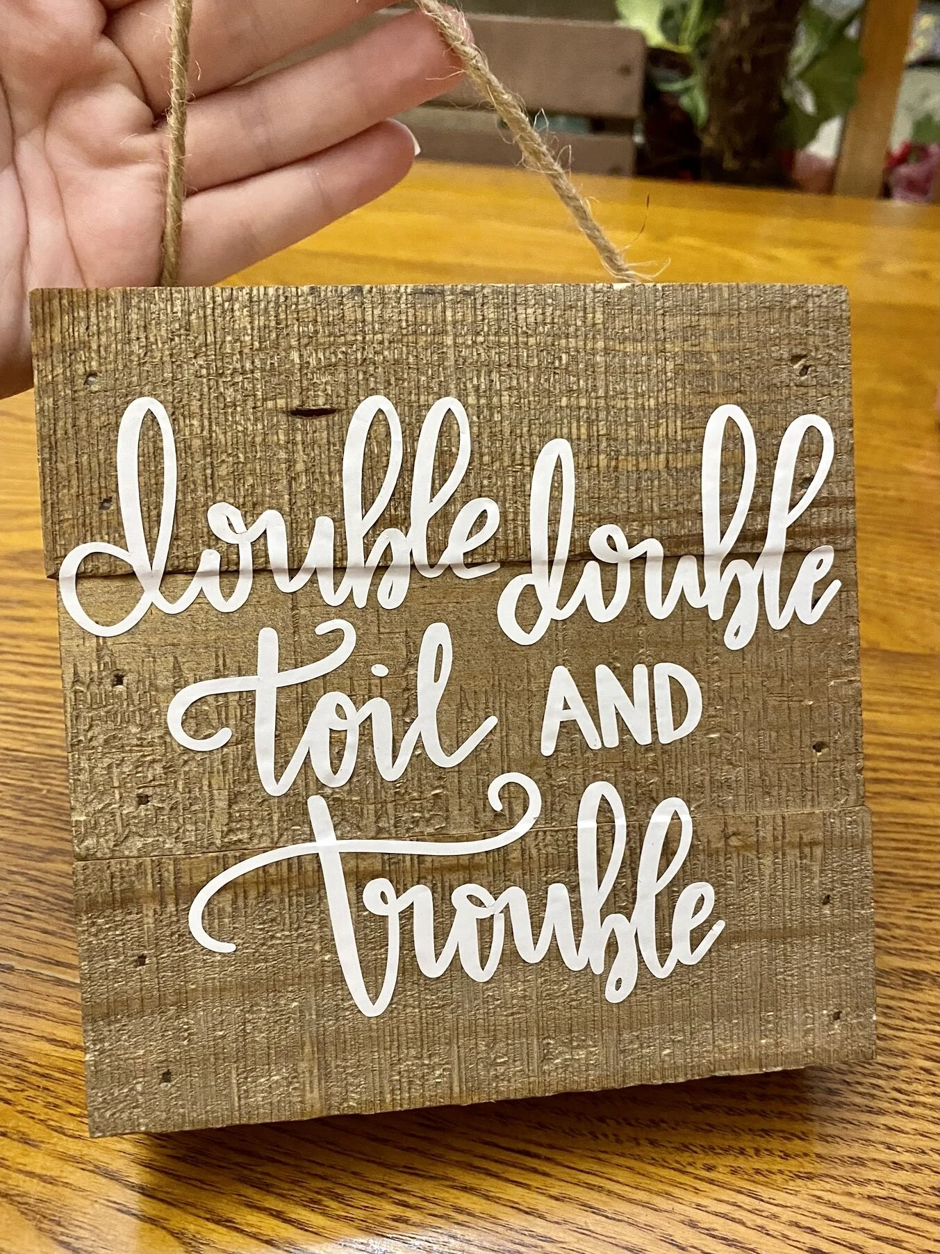 A wooden Halloween sign I made with my hand lettering cut out of vinyl using my Silhouette Cameo
