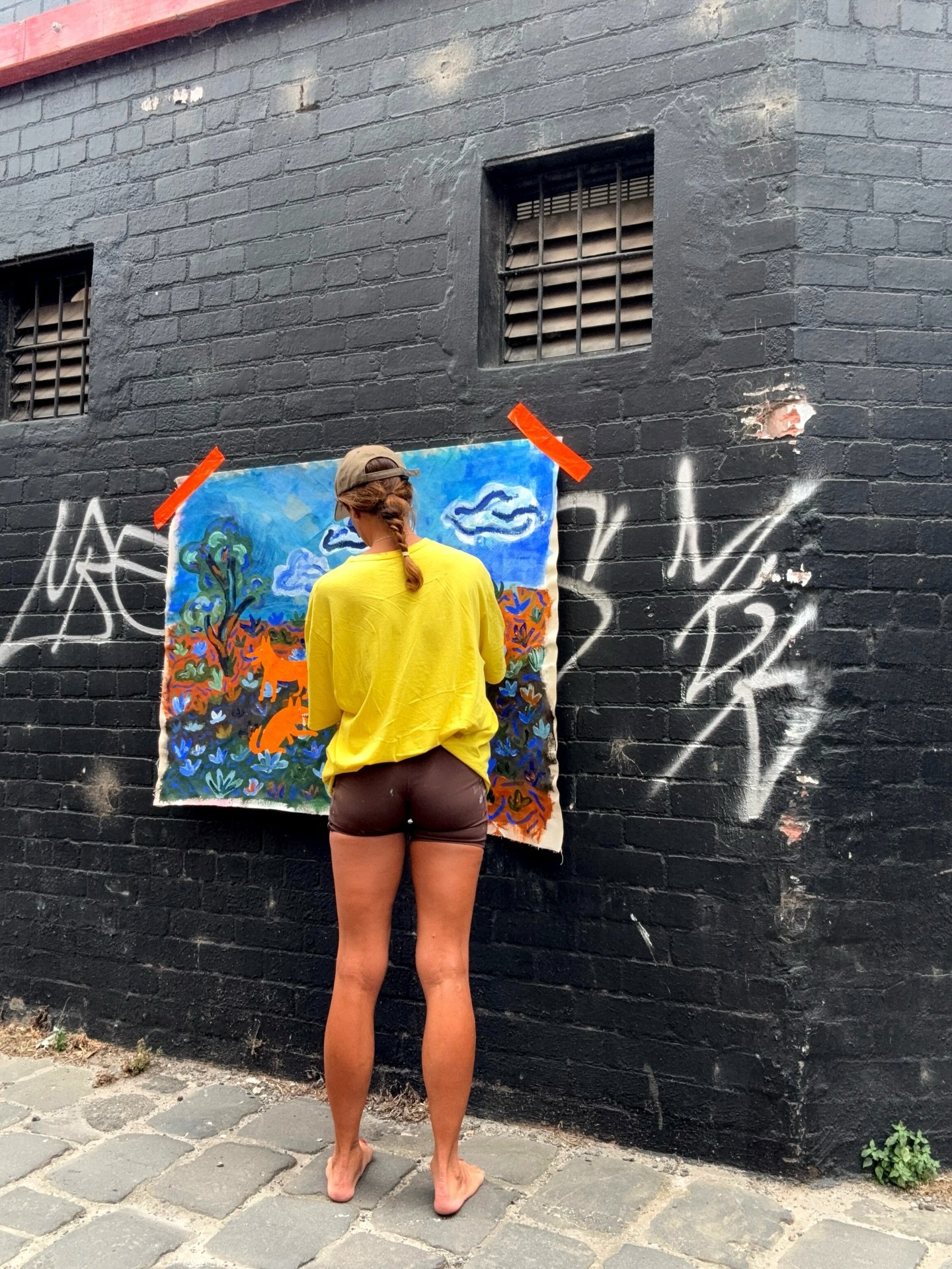 | WORK IN PROGRESS |

When you get tired of sitting inside because you know summers heat will not be around forever, a Melbourne laneway becomes your studio. 

I&rsquo;m really loving the process of this painting, especially the dingos. I&rsquo;ve be