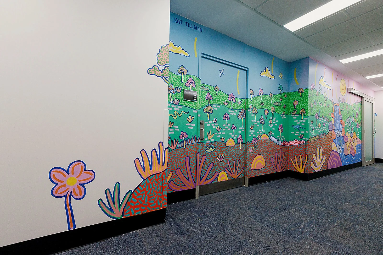 Colourful Australian landscape mural by Melbourne artist Kat Tillman at Latrobe Community Health Service in Churchill, Victoria.