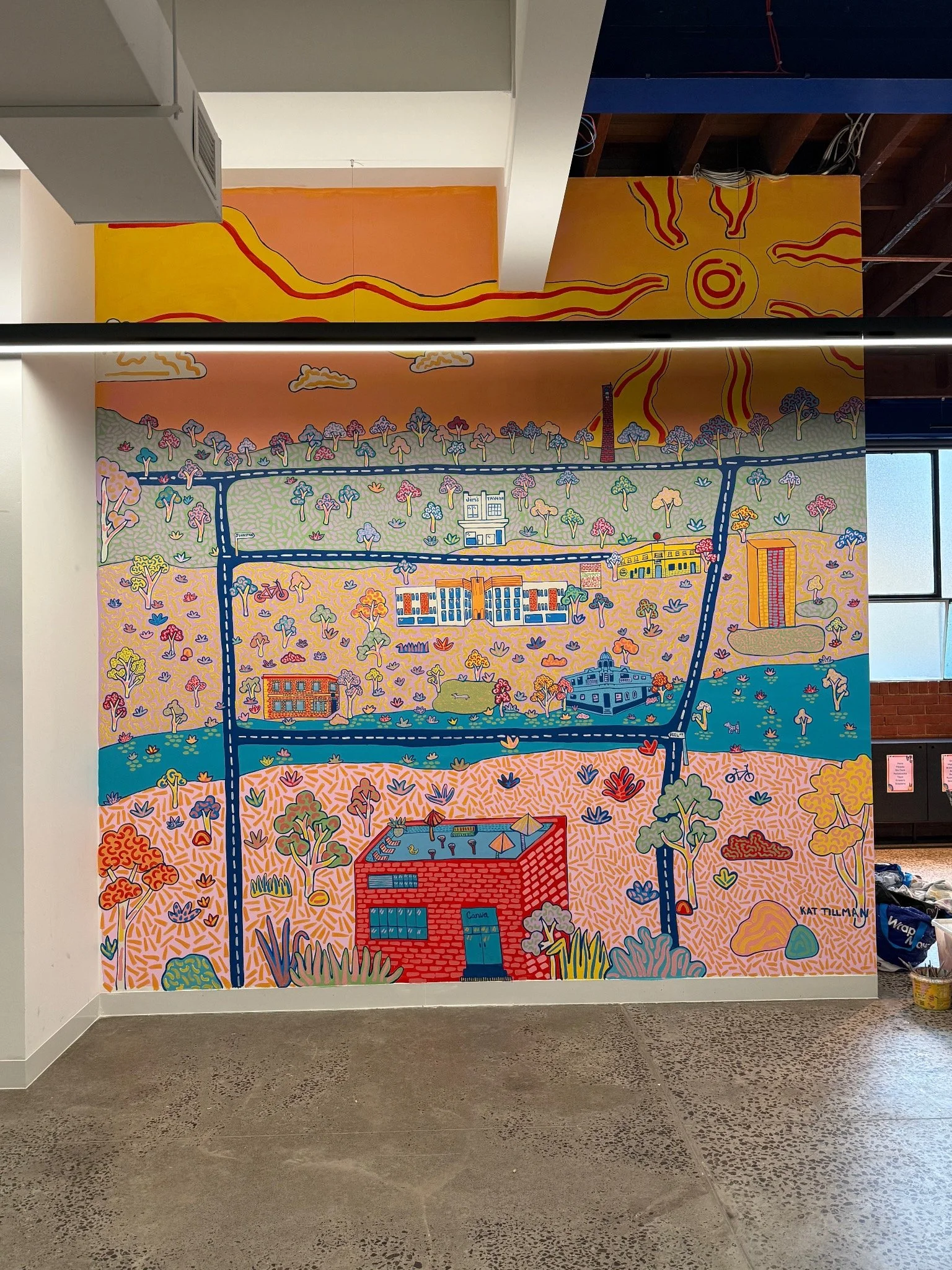 Colourful illustrated map mural by Melbourne artist Kat Tillman featuring Collingwood landmarks, streets, native trees and playful local details.