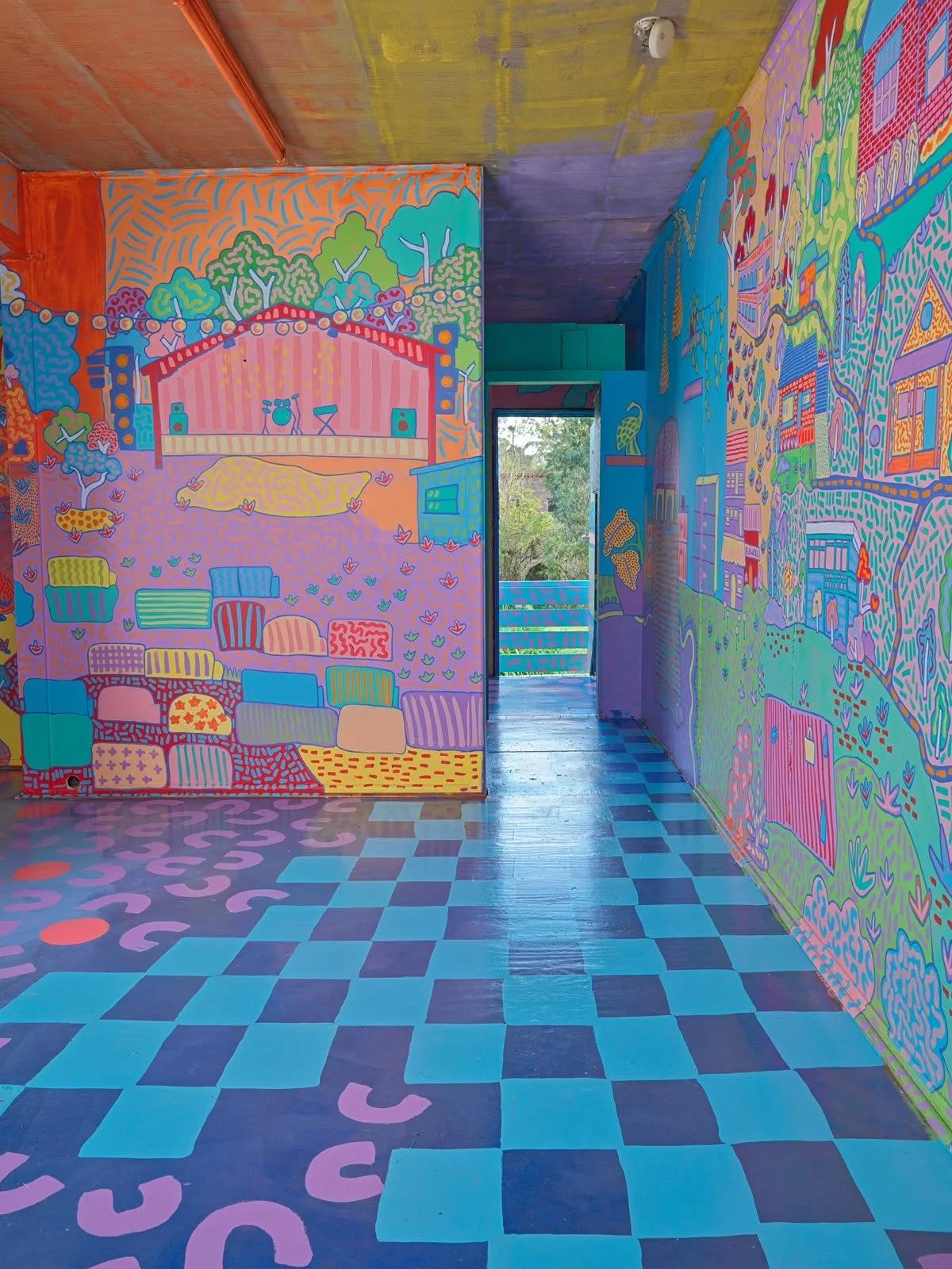 Immersive mural installation featuring colourful painted walls and a whimsical interior landscape inside Kat Tillman's Side Quest Stories house in Warrandyte.