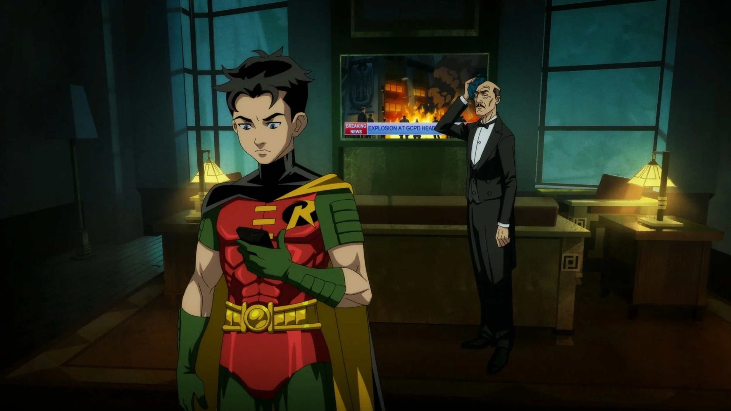 Robin and Alfred watch news of an explosion in Gotham in Batman: Knightfall Part 1 (2026).