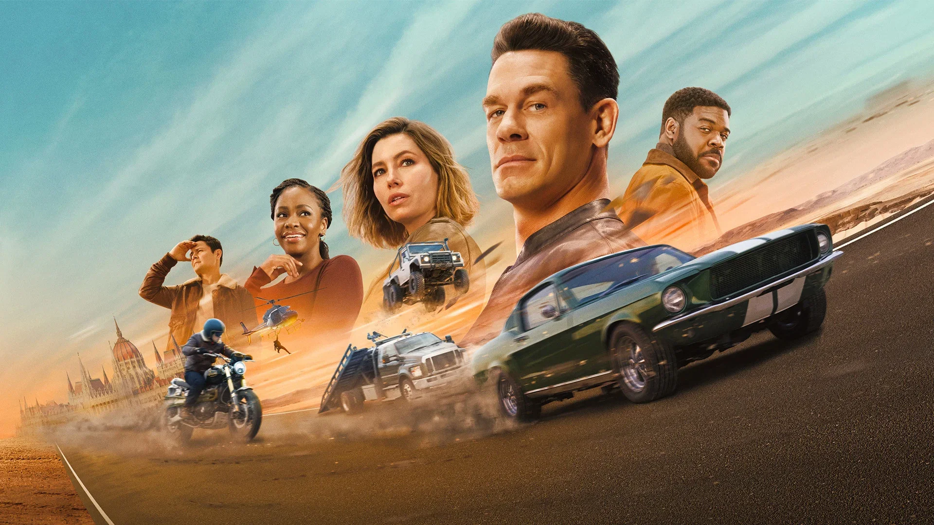 Promotional artwork for Matchbox: The Movie featuring John Cena, Jessica Biel, Teyonah Parris and other cast members above cars, motorcycles and helicopters racing across an open road.