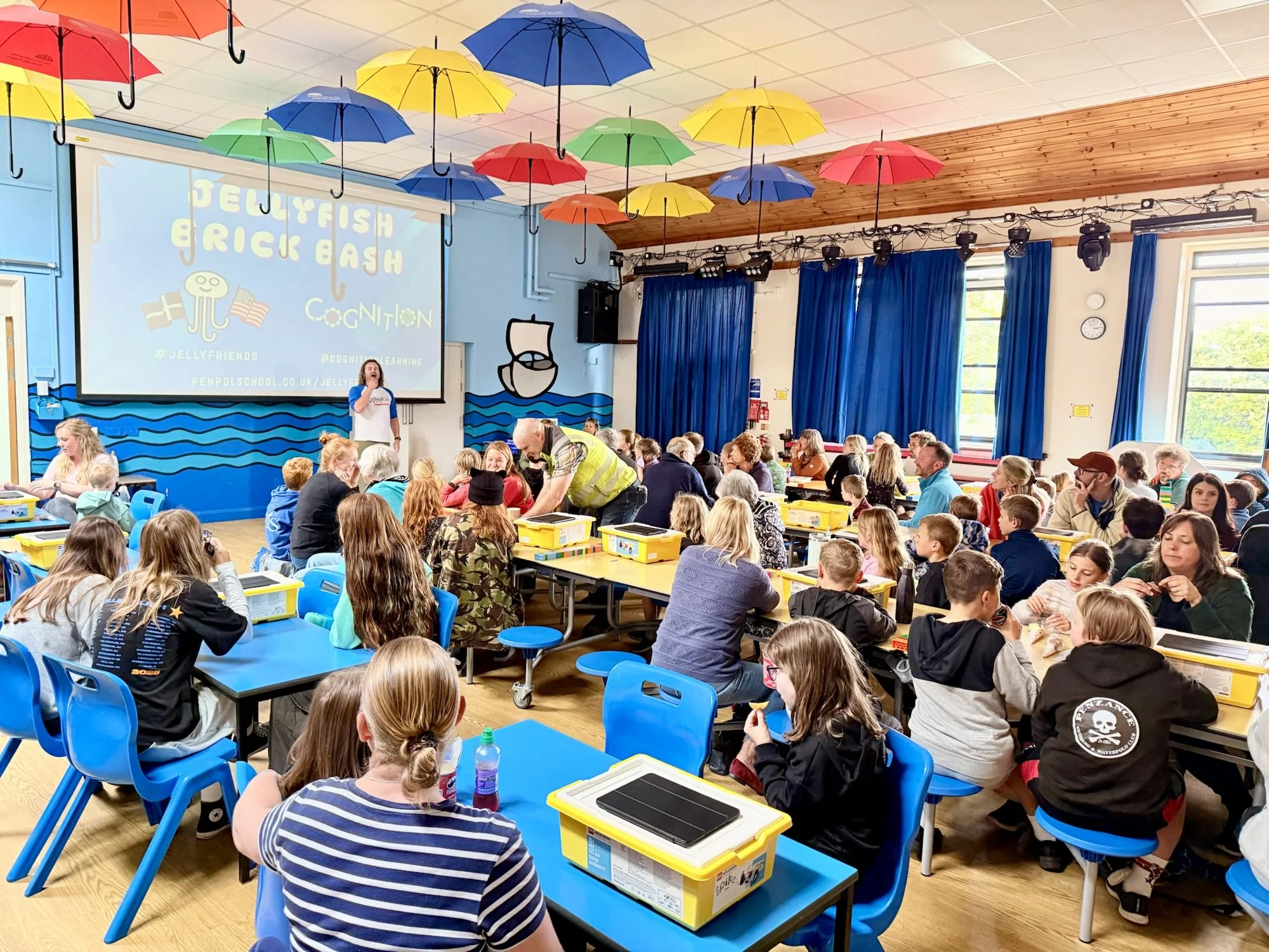 Full family workshop with people enjoying LEGO Robotics led by cognition staff