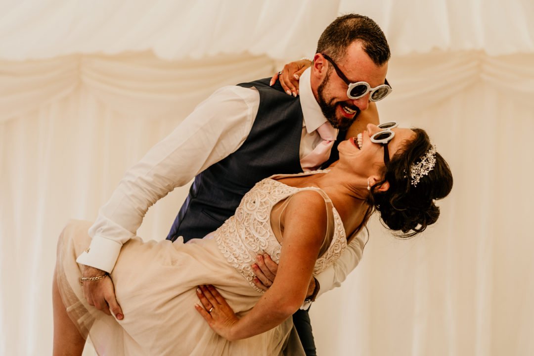 32 The bride and grooms first dance during a marquee wedding reception at Pentillie Castle by Noah Werth Photography.jpg