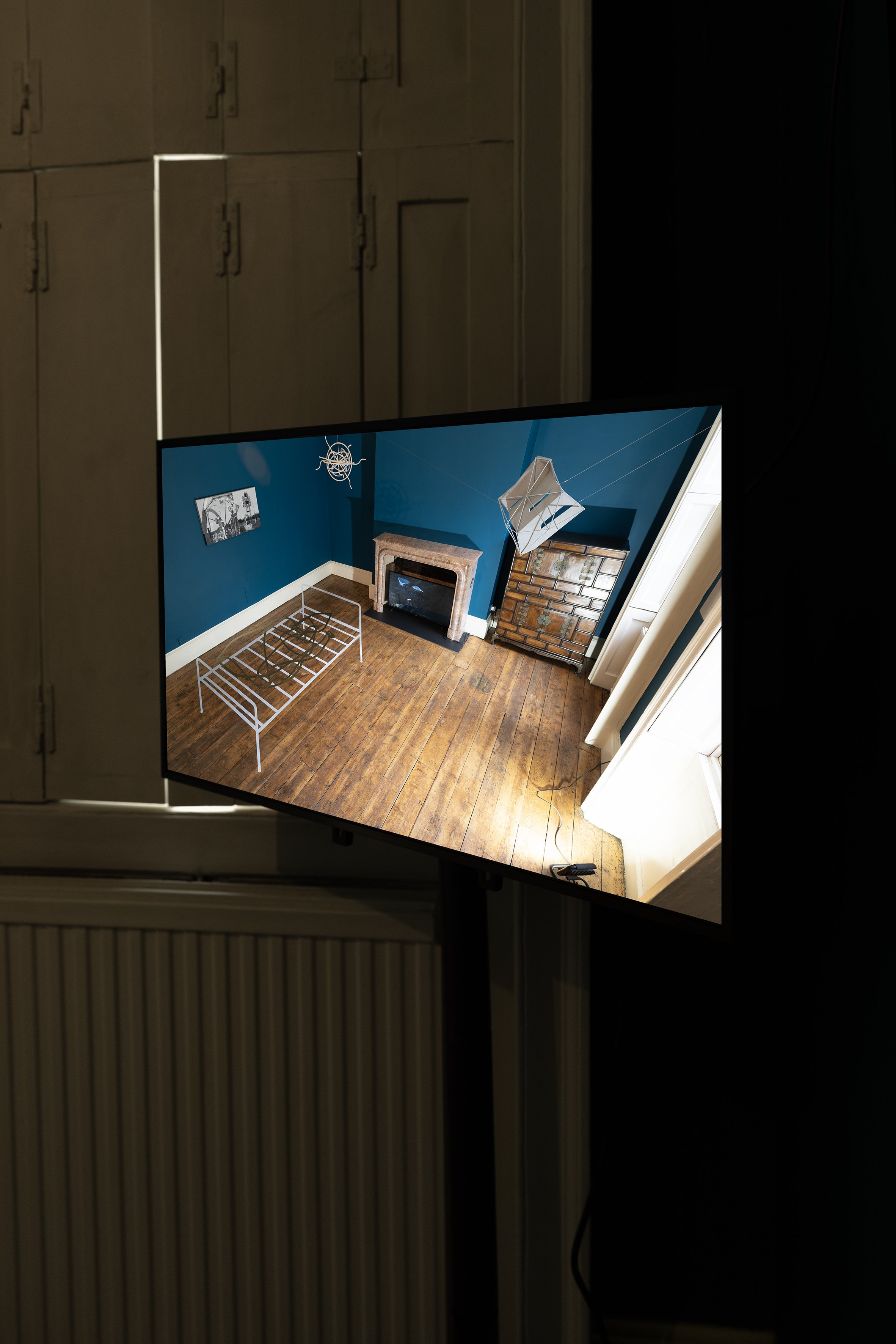 Propellers and Propositions (2024)
Vinyl, closed-circuit video camera, HD monitor. Floor section: H 330 x 183 cm, wall section: H 15 x 32 cm. Installation view Danielle Arnaud Gallery, London, 2024. © Ergin Çavuşoğlu.