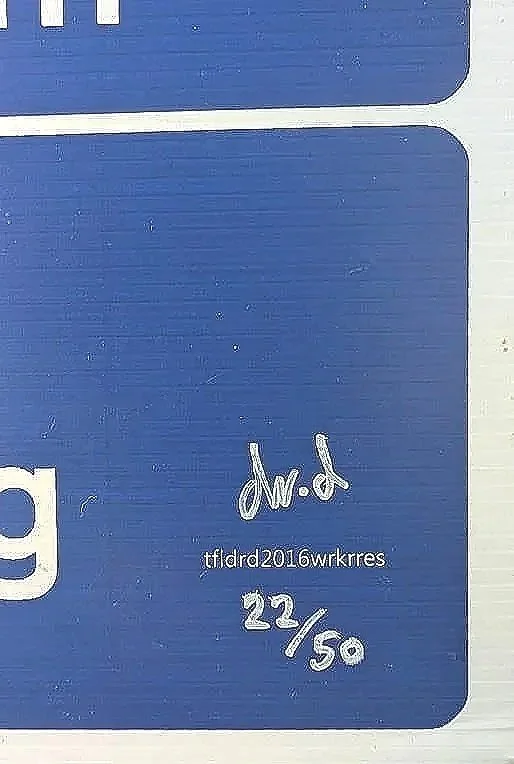 close up of signature and edition number