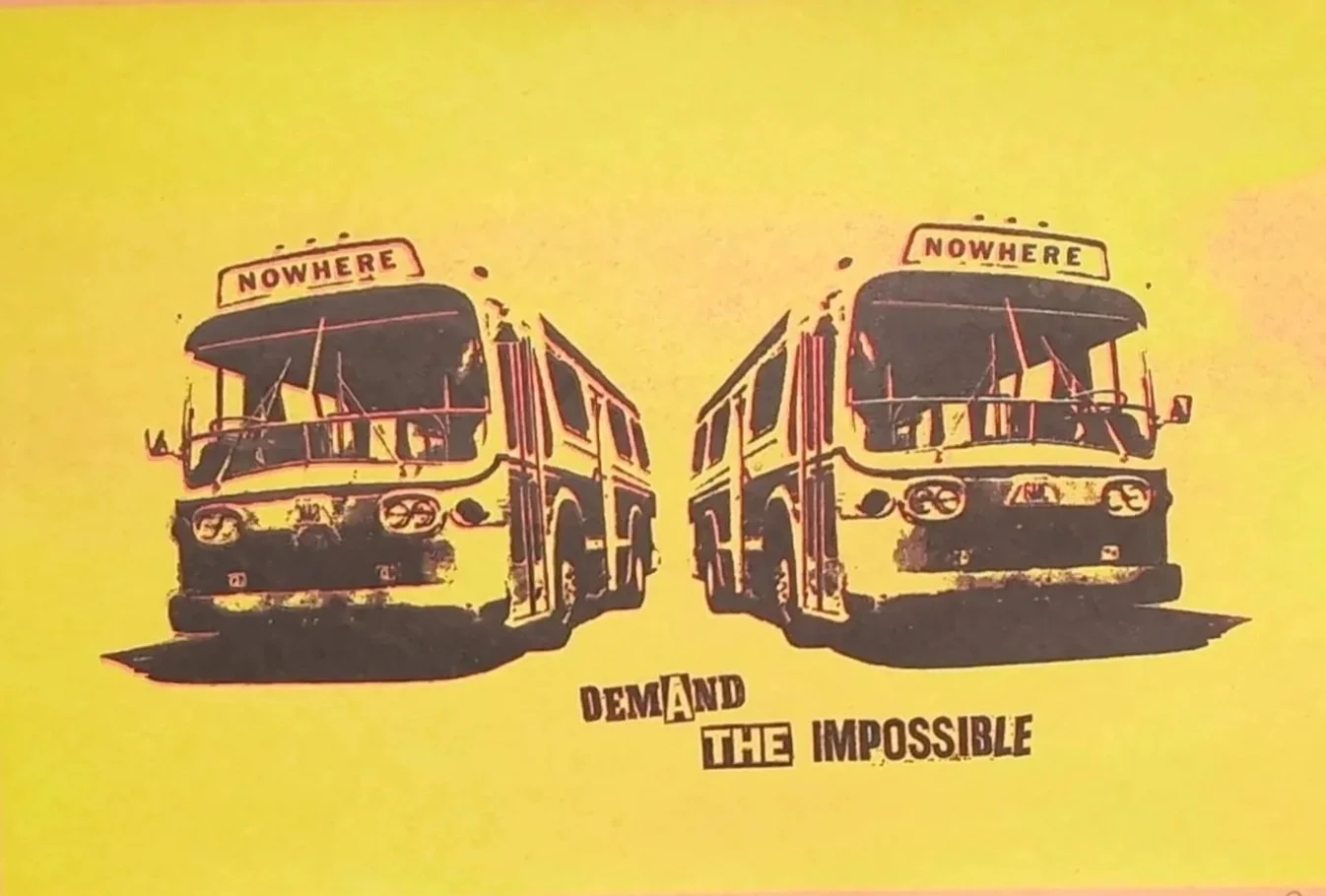 Jamie Reid Nowhere Buses Yellow red and black background featuring two buses displaying the destination as Nowhere with Demand The Impossible underneath. A CLOSE UP IF THE BUSES.JPG