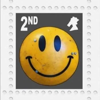 A yellow battle scarred ex police riot shield on a black background 2nd class giclee in the style of a stamp by James, Jimmy, Cauty, limited edition published by L13 gallery