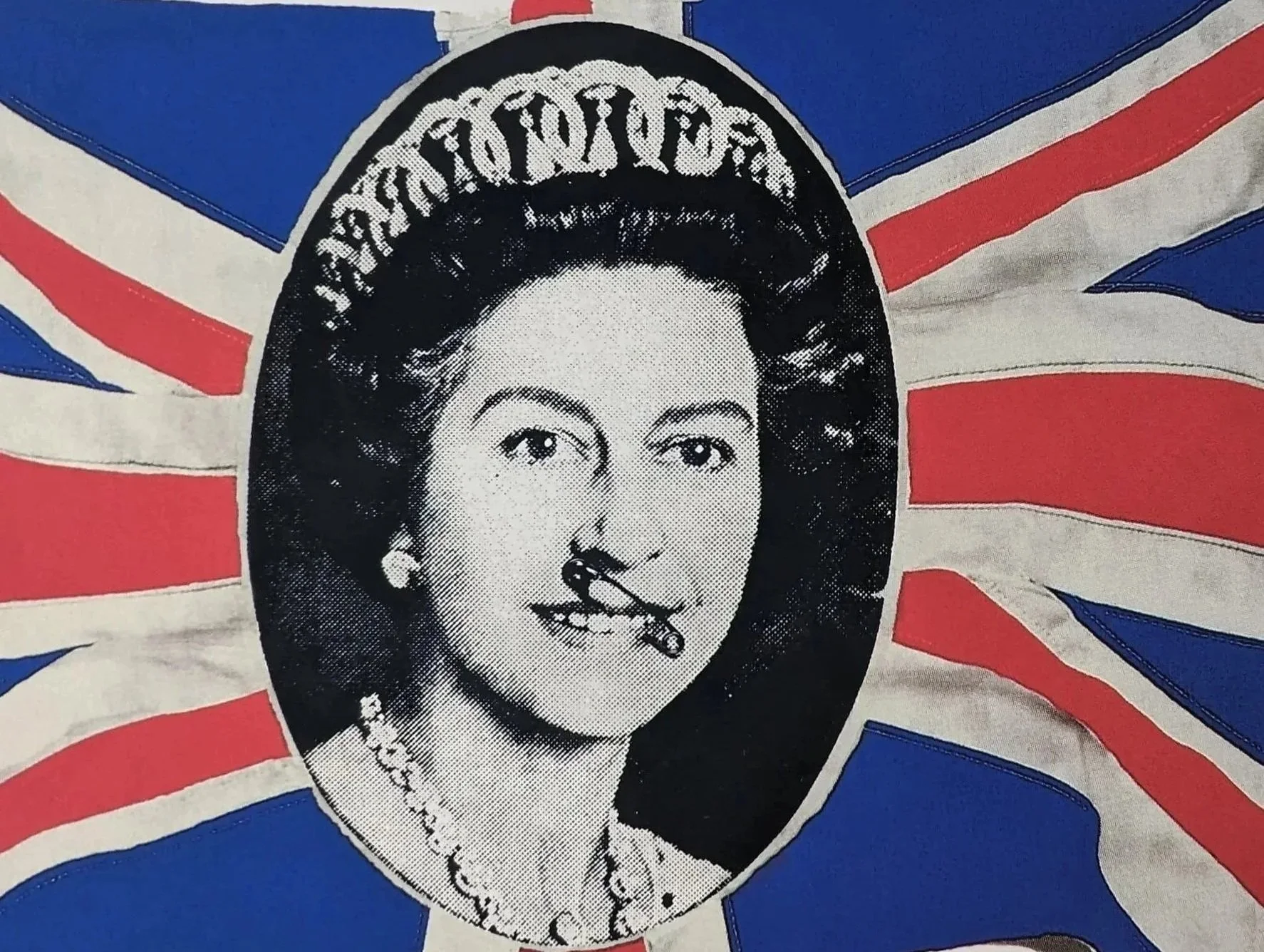 Jamie Reid " God Save The Queen" punk classic safety pin lip QE2 union jack flag background.