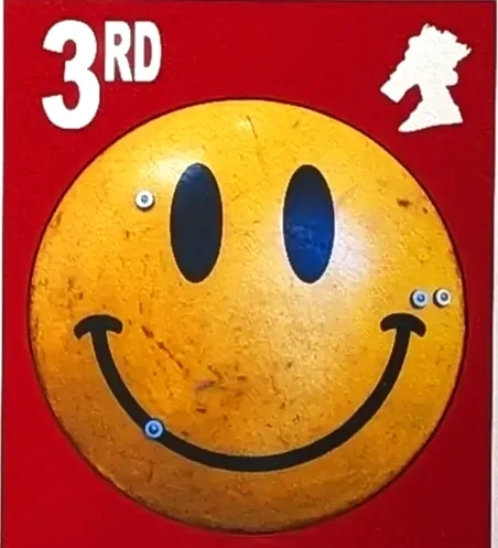 Jimmy Cauty 3rd Smiley Riot shield battle hardened on a red background its only paper