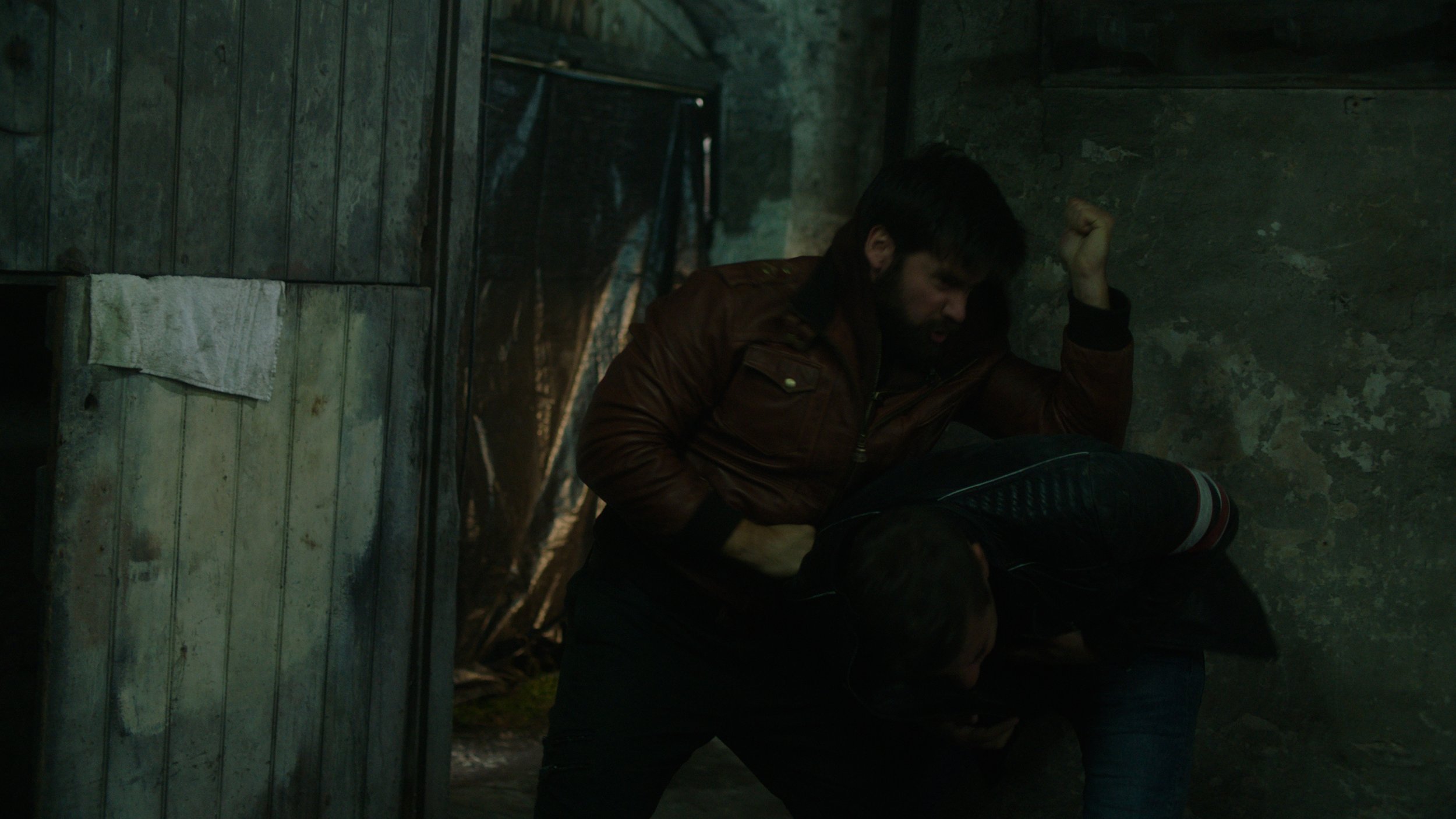 Mark Rowley as Rhys and Paul Ginns as Mac