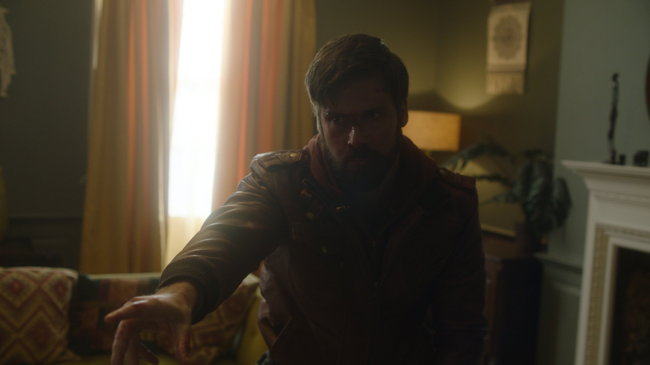 Mark Rowley as Rhys