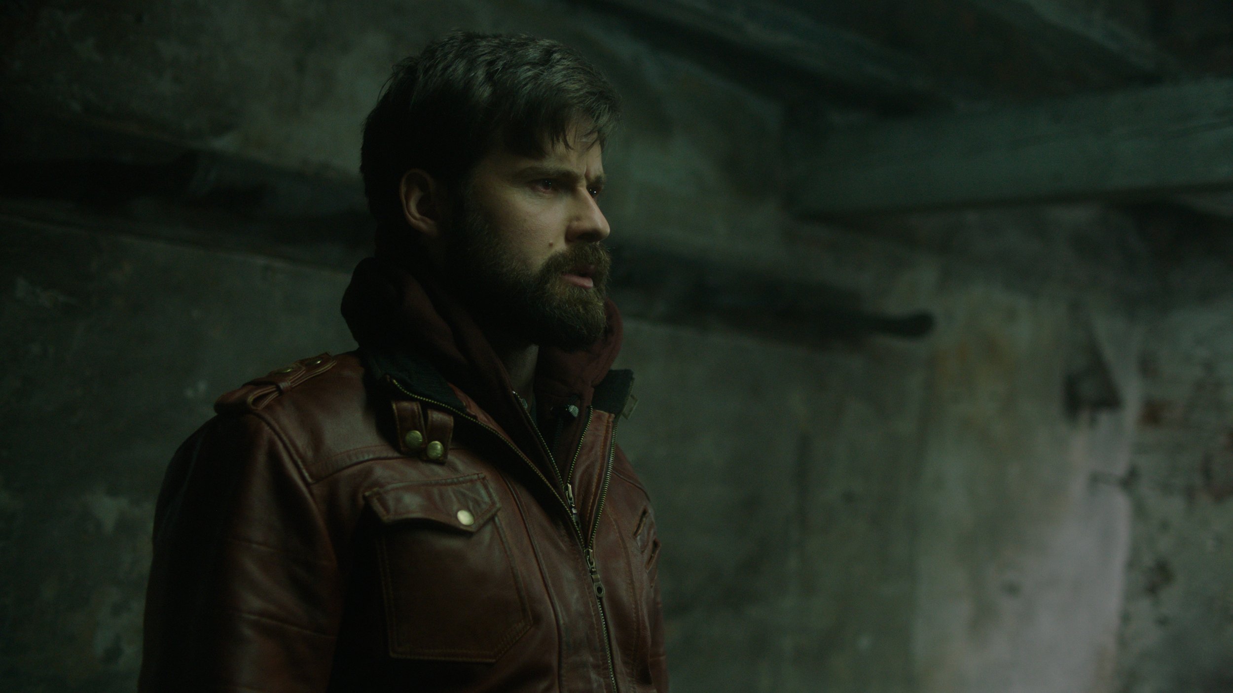 Mark Rowley as Rhys