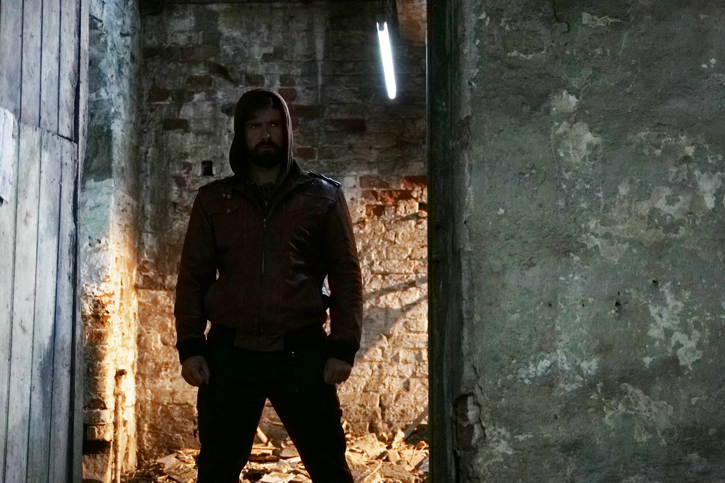 Mark Rowley as Rhys