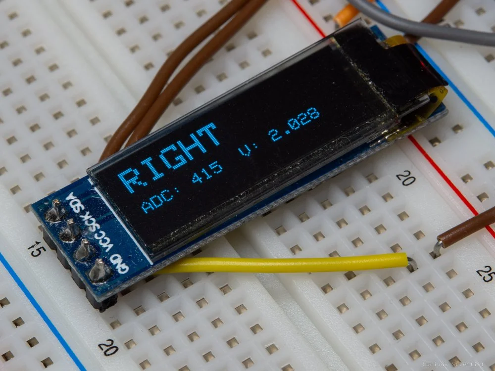 A test result printed on the OLED display
