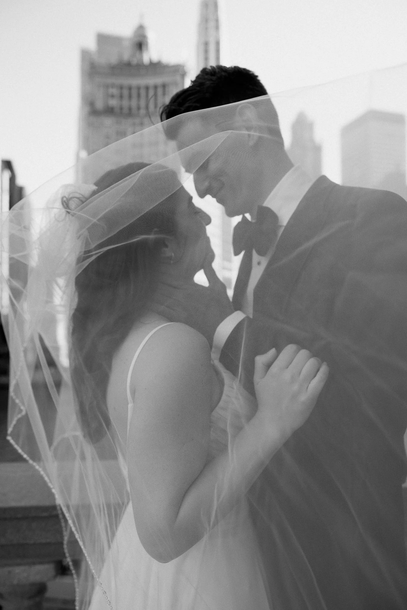 Chicago wedding micro wedding officiant couple almost kissing under veil