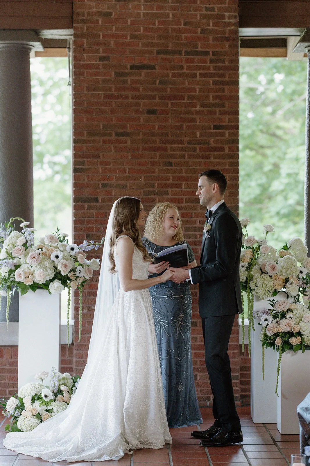 South Loggia Cafe Brauer Wedding Ceremony Officiant white florals