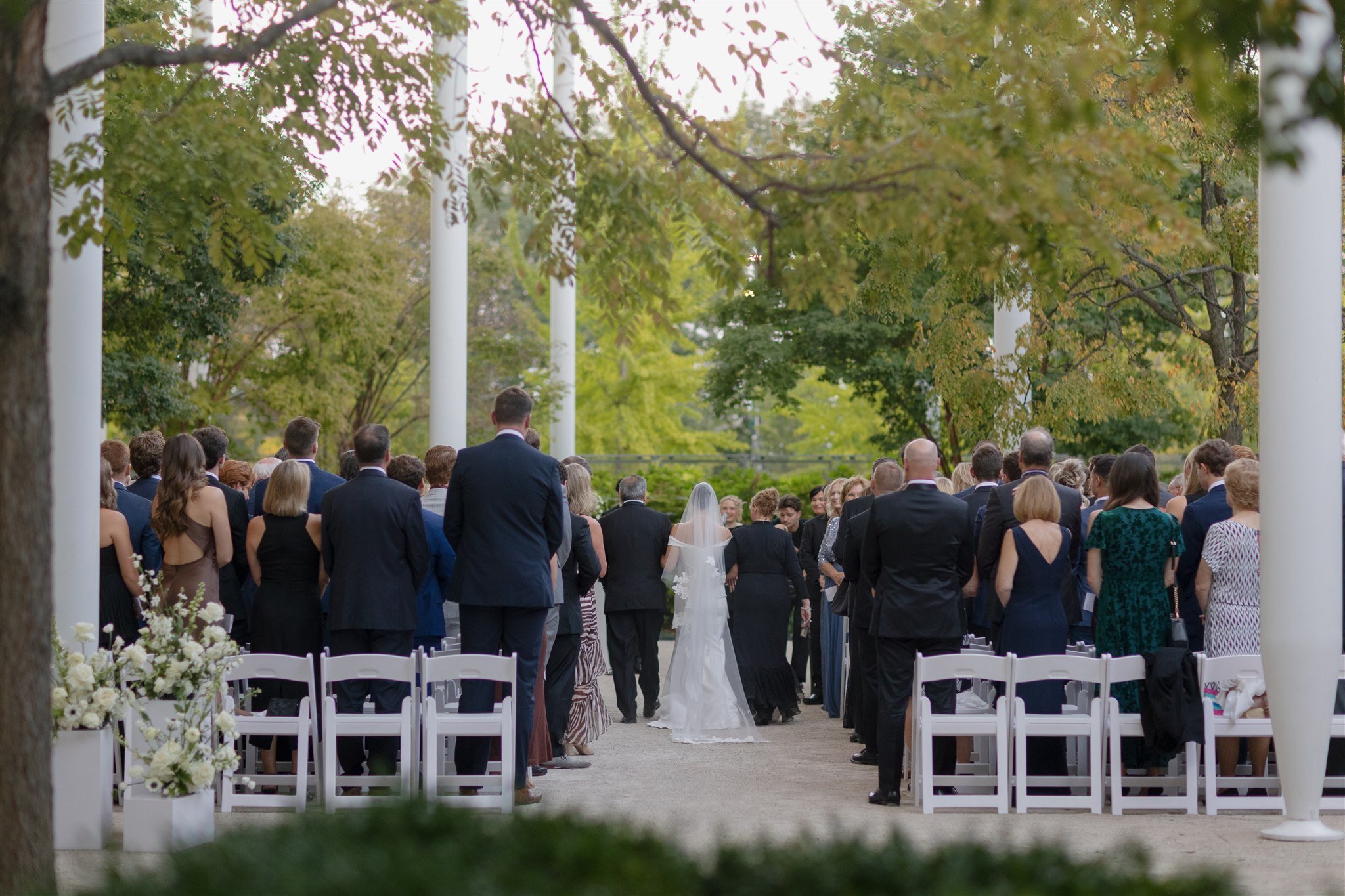 Bride escorted down the aisle at the Art Institute Chicago.  Photograph by Bradley Moss Photography