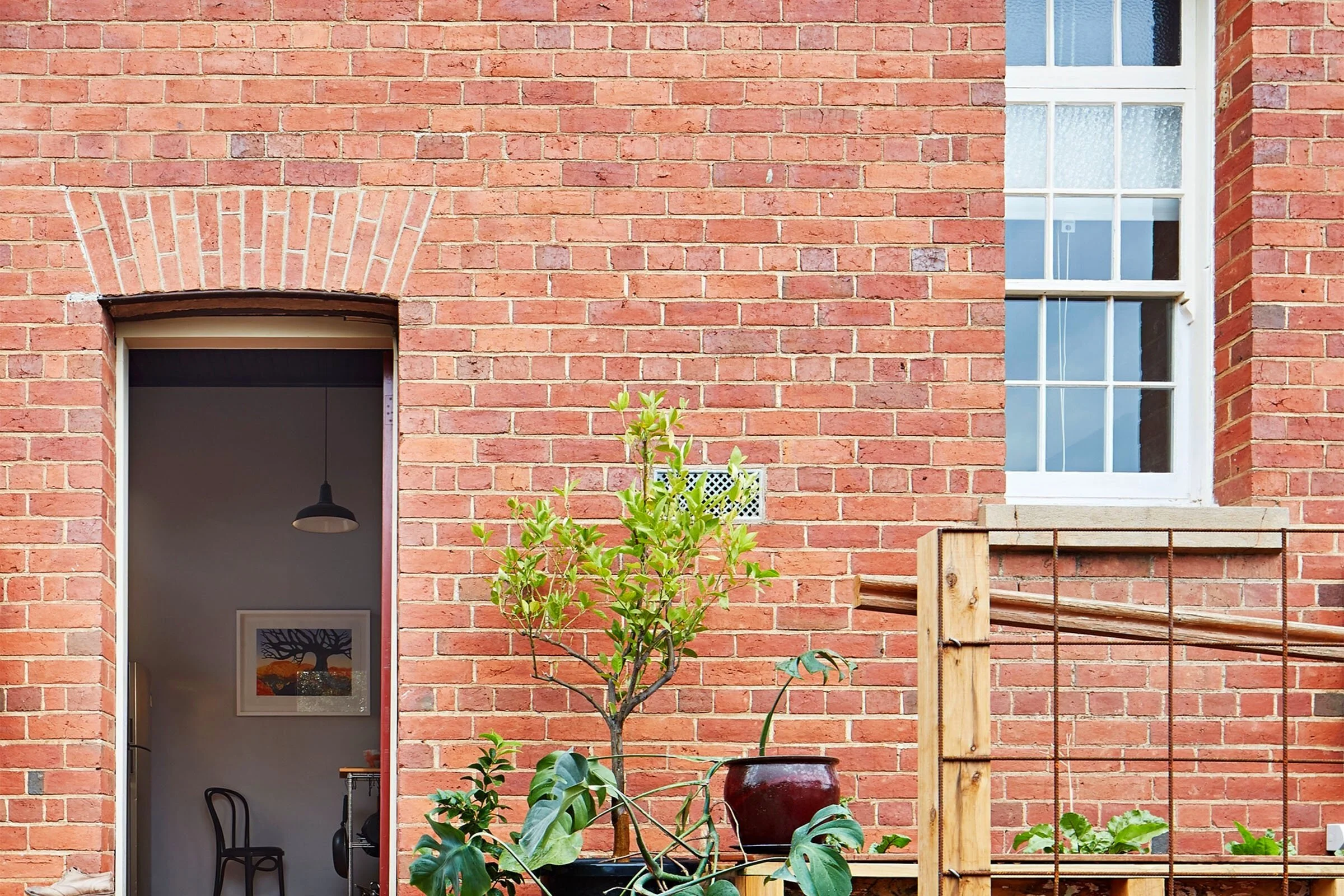 Freemasons Residence, exterior entry, brick facade, residential architecture
