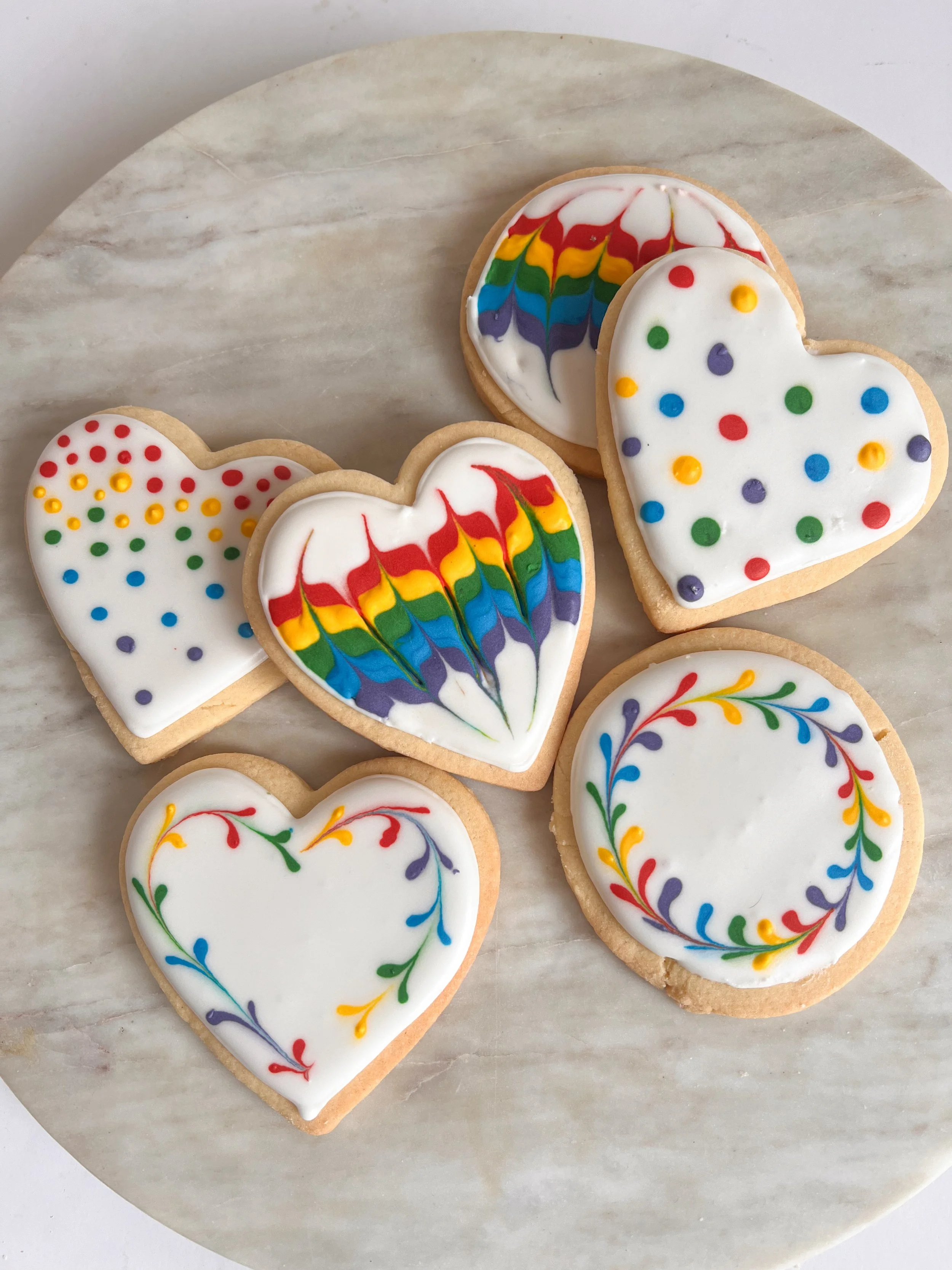 beautiful cookies decorated with various kinds of rainbows