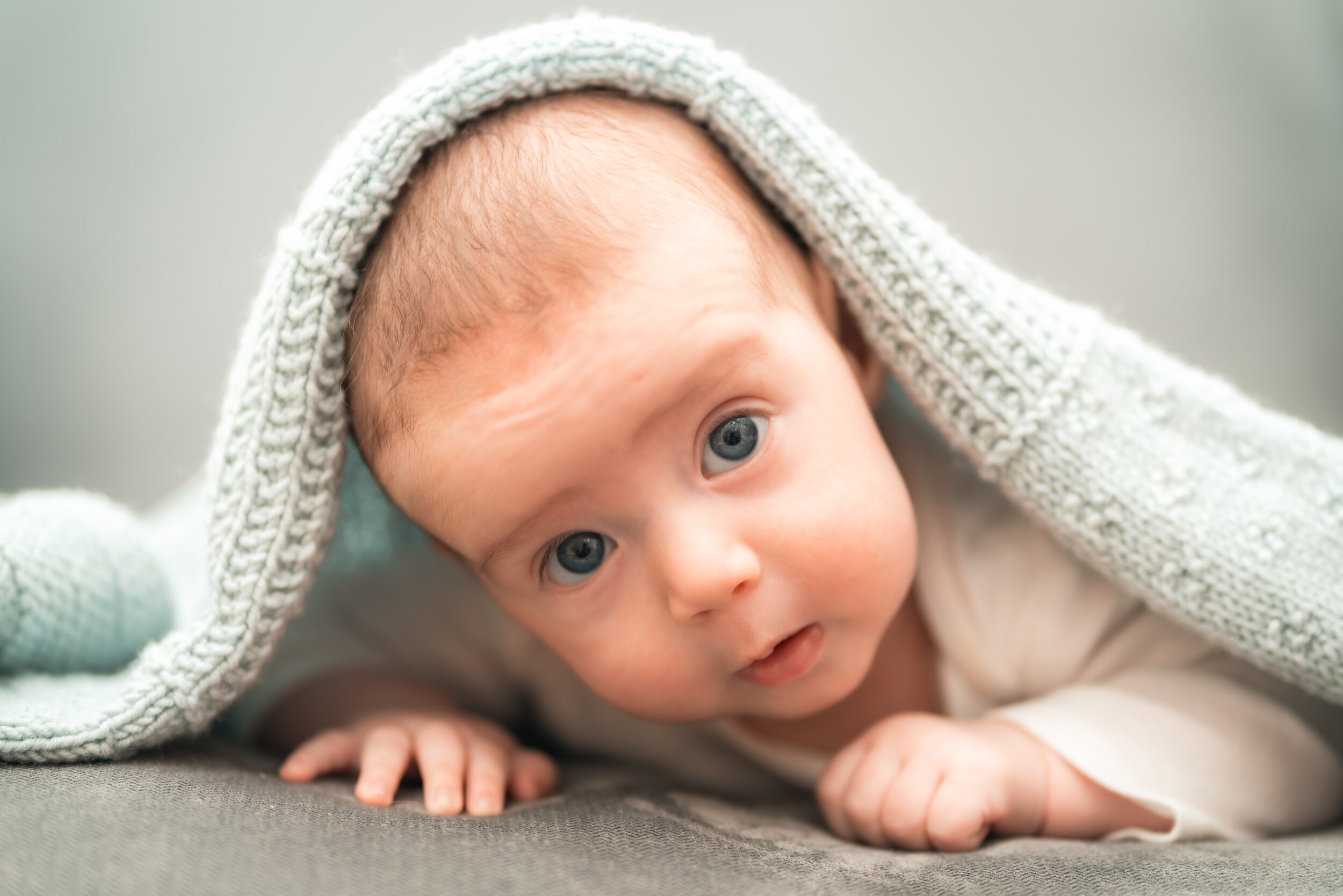 When we do newborn photography, we try to capture what makes that little one special: a mixture of softness, love, and innocence (plus a lot of patience) so we can get those pictures you'll be looking at forever.
