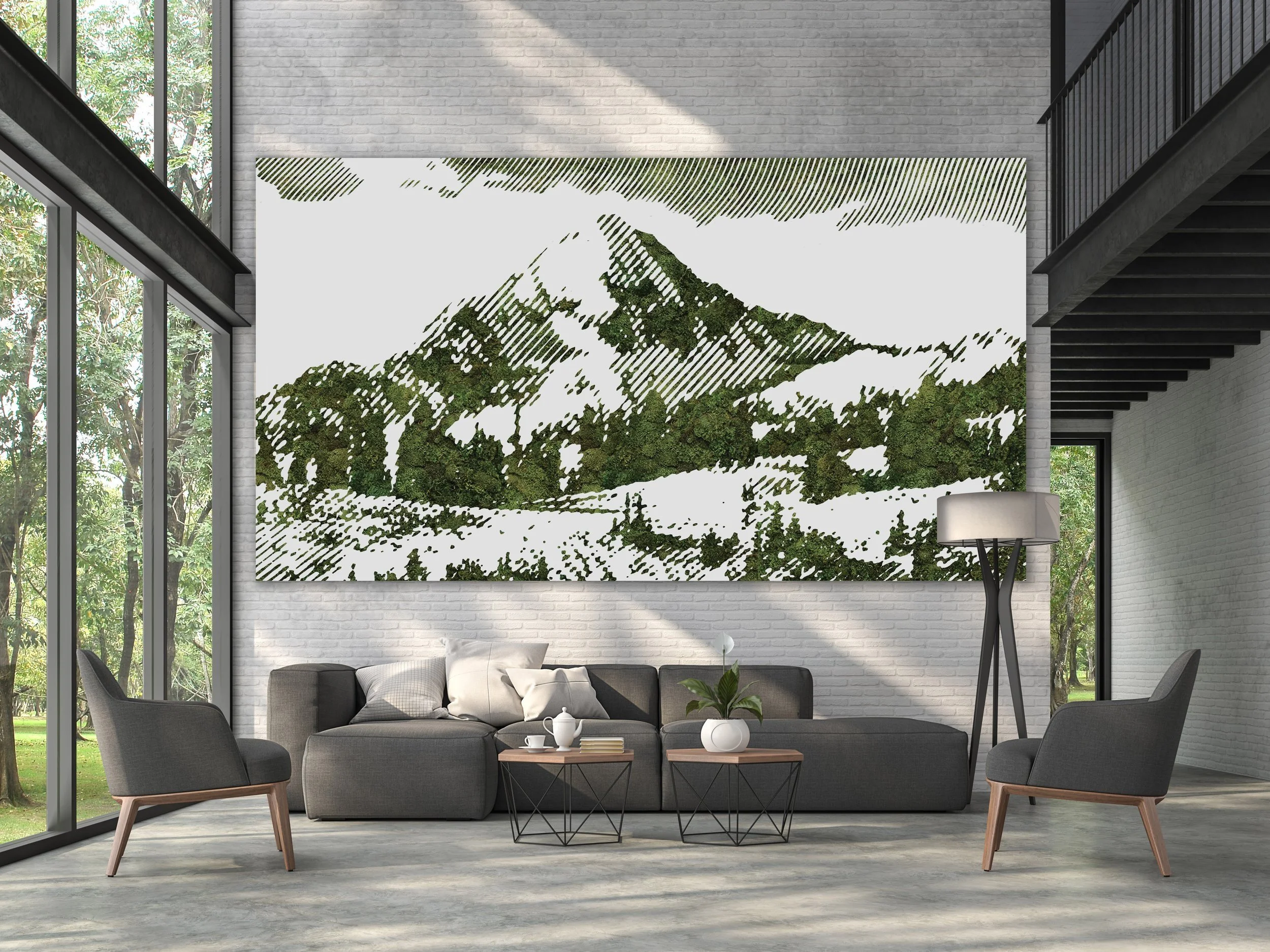 Modern living room with gray sofa, two gray armchairs, a coffee table, white vases with green plants, and a large preserved moss wall art featuring a mountain with snow and greenery, surrounded by large windows showing green trees outside.