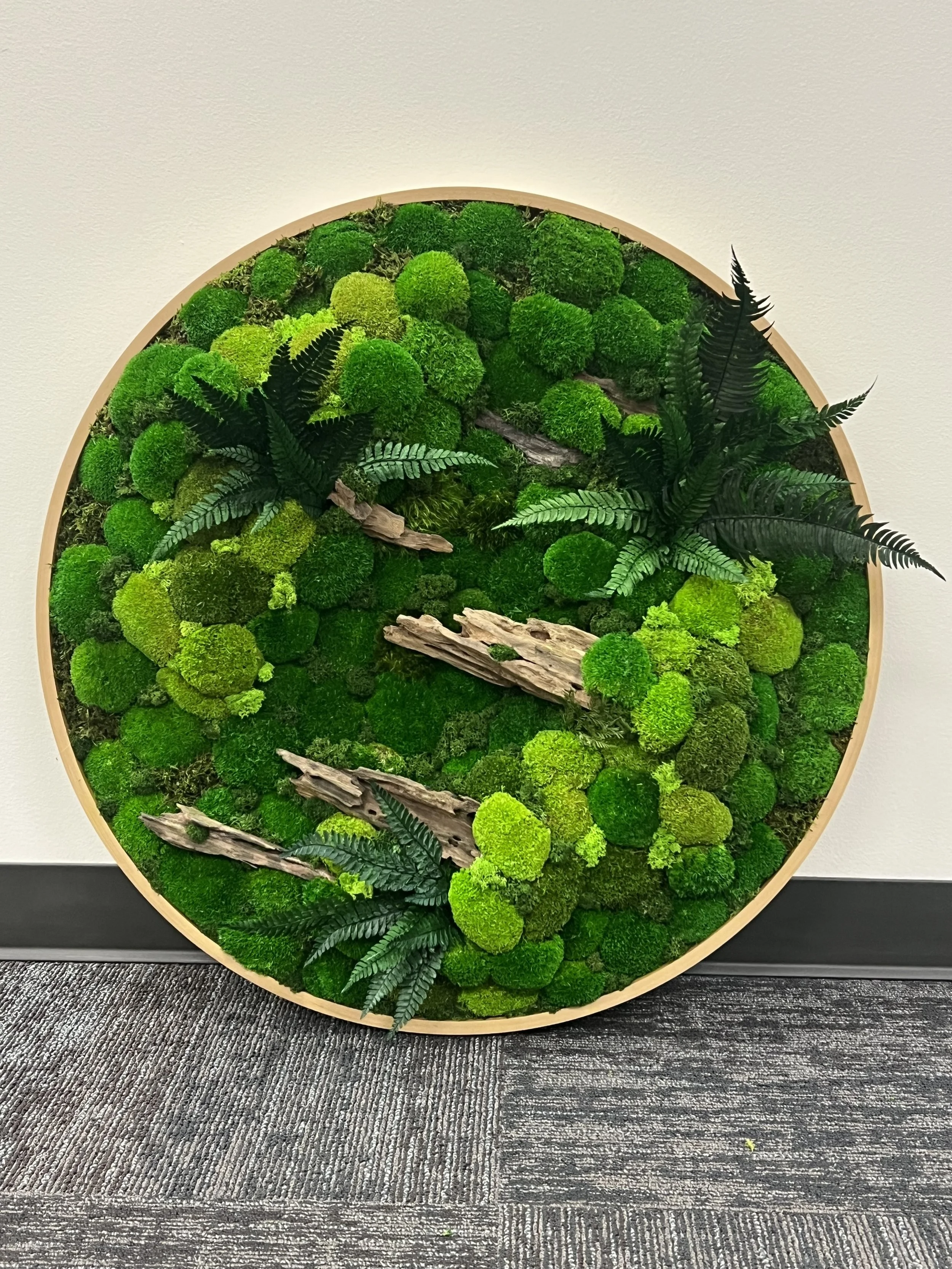 Moss wall art installed in the Island Square apartment lobby