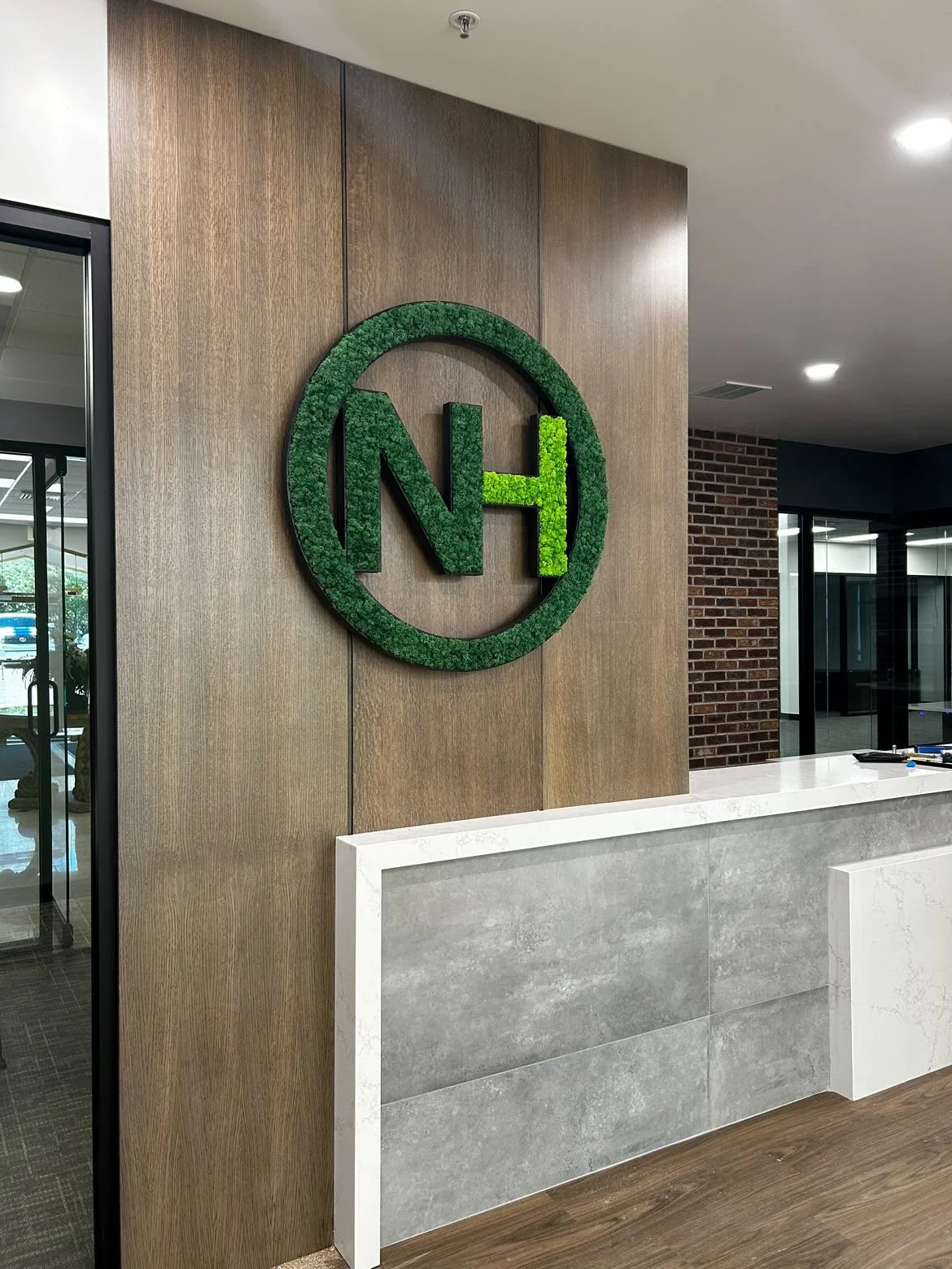 Preserved moss art installation in a Nilson Homes office space