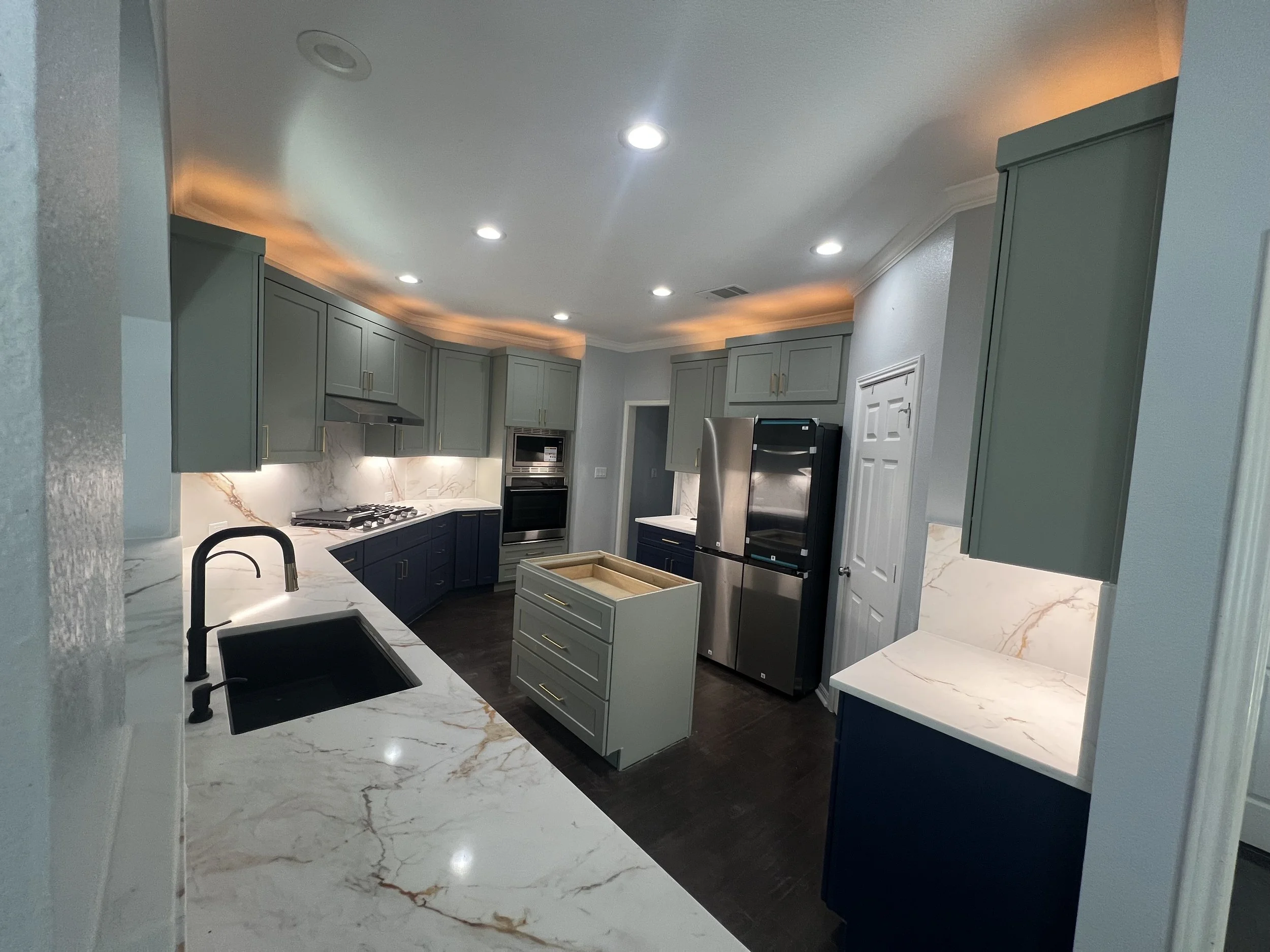 Kitchen Transformation in Round Rock, Texas with Shaker Moss & Shaker Navy paired beautifully with quartzite countertops