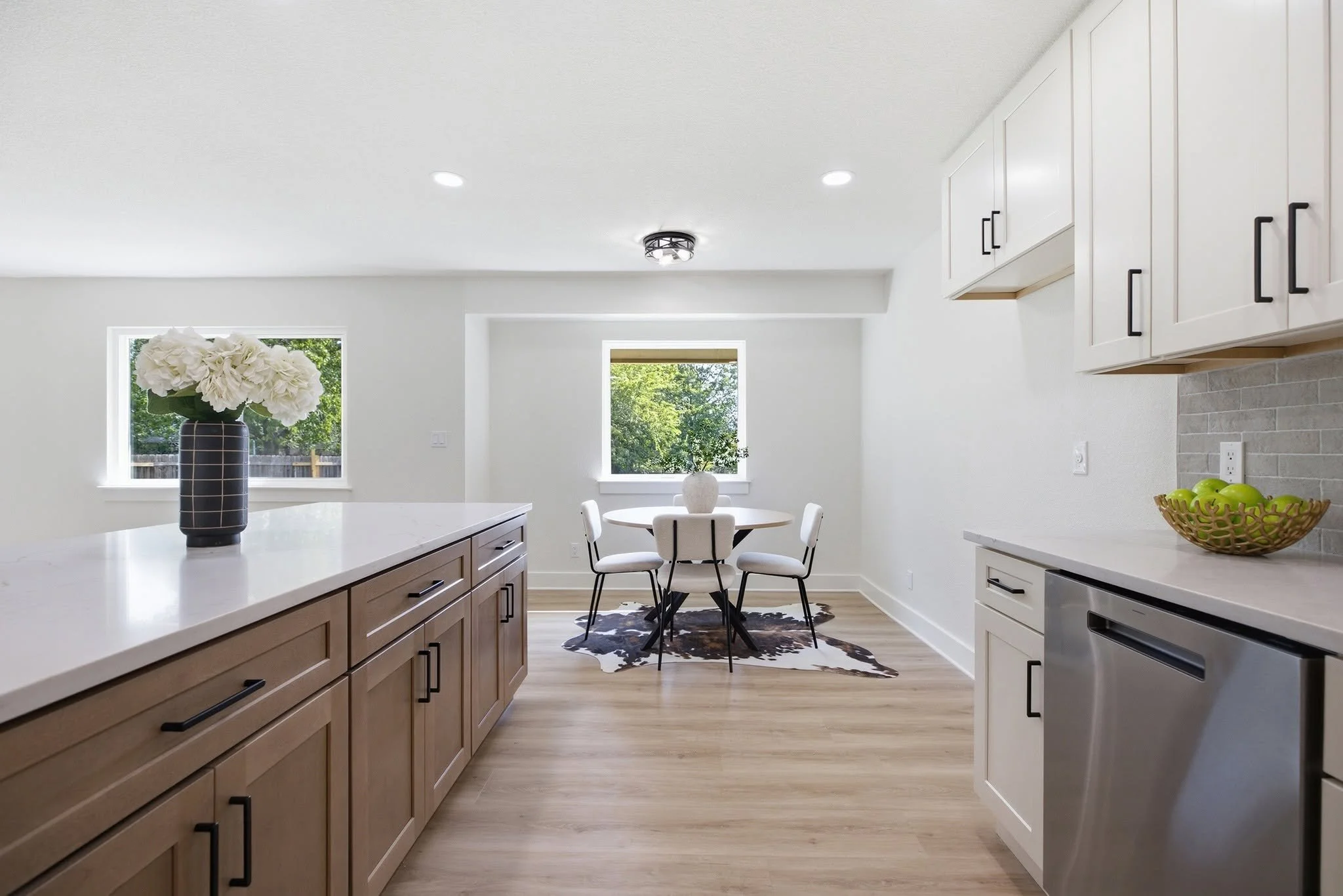 Kitchen Remodel in Round Rock, Texas. Shaker Antique White and Shaker Caramel. Calacatta Alba countertops 