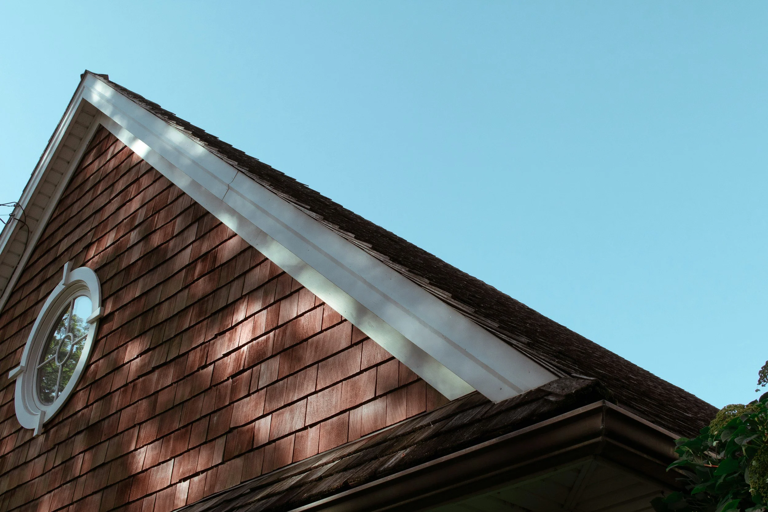 Cedar shingle gable and roofline of a house