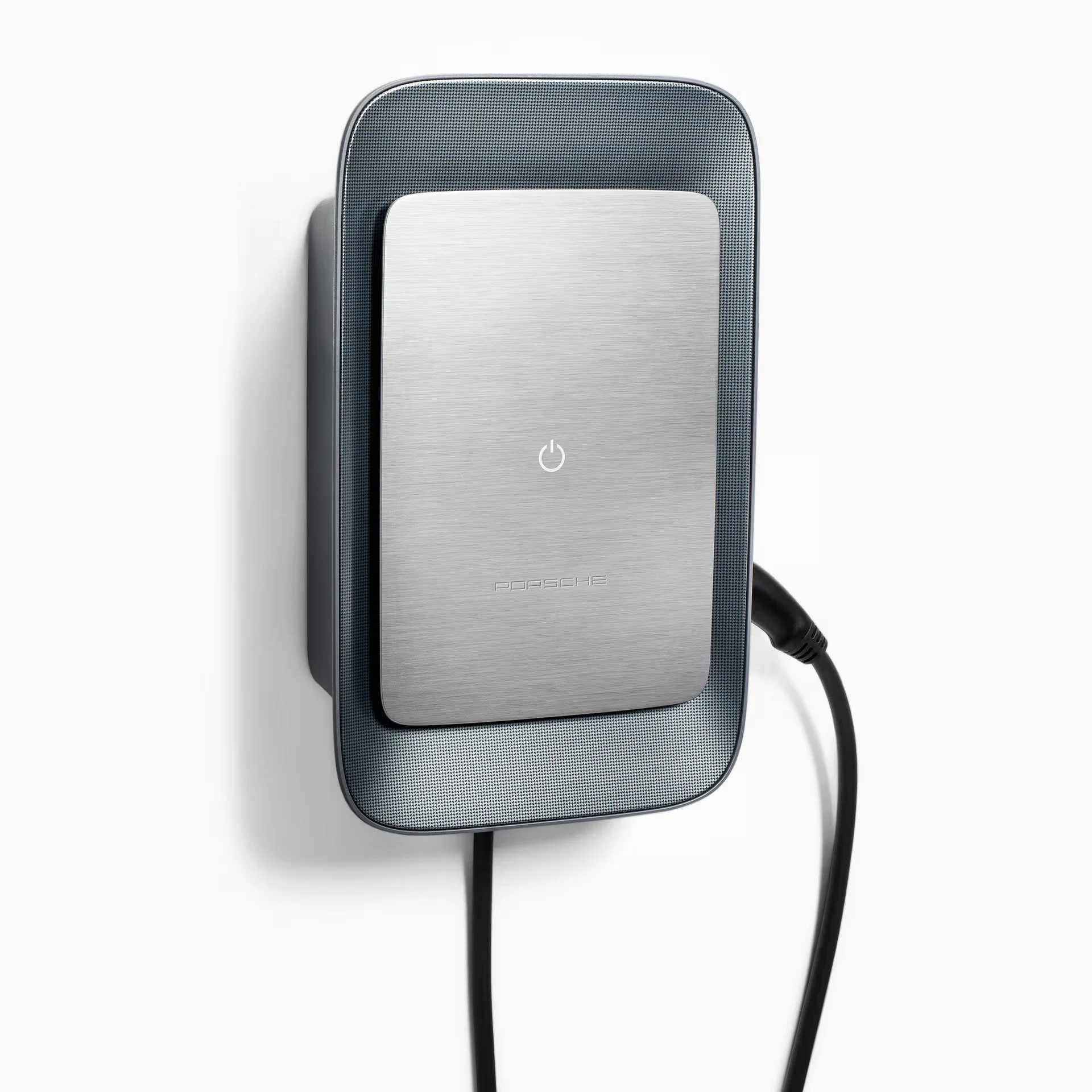 Electric vehicle charging station with a metallic surface and a power button icon, connected to a charging cable.