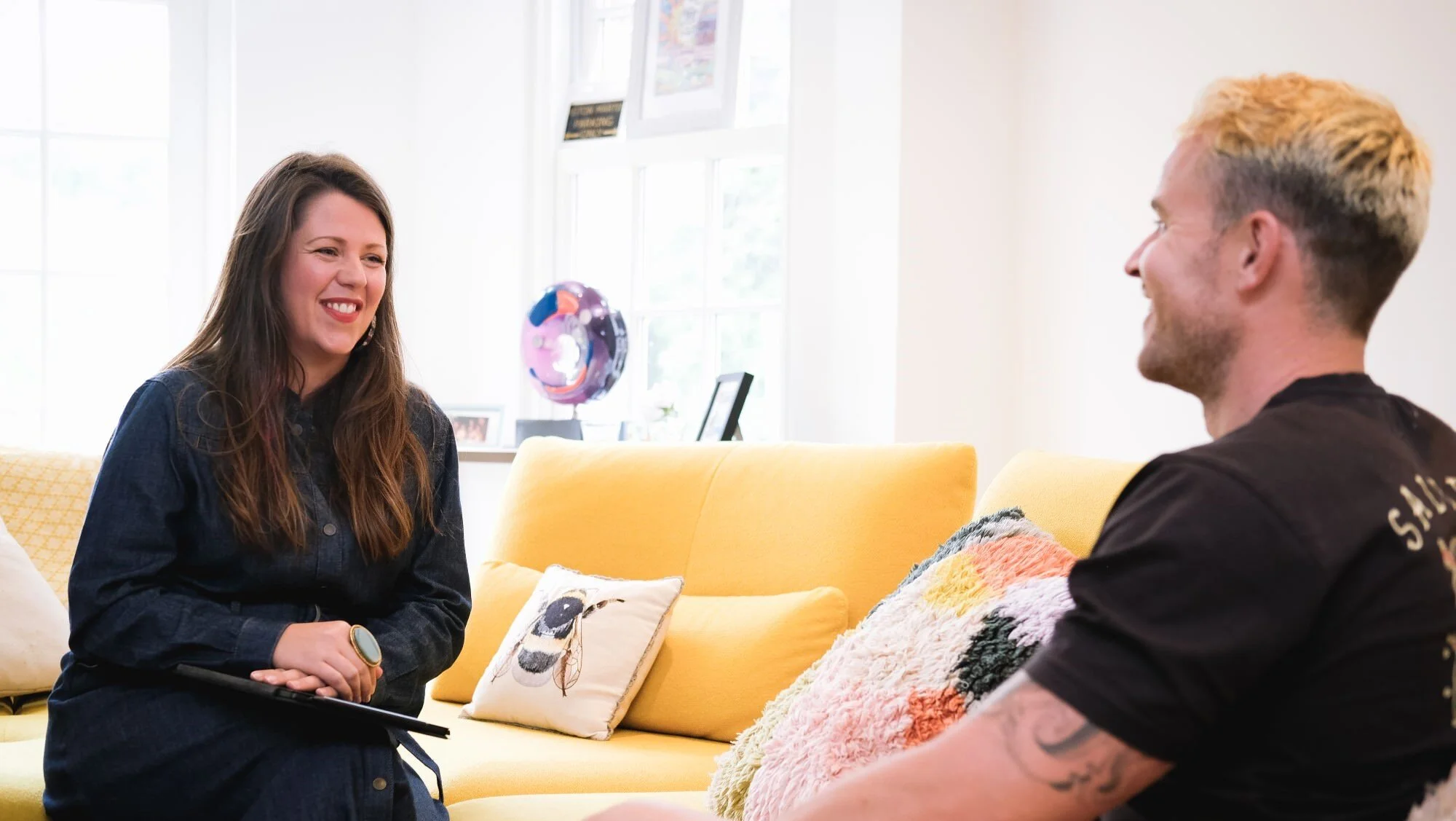 Sara Maxwell supports a financial coaching client to know and own their money