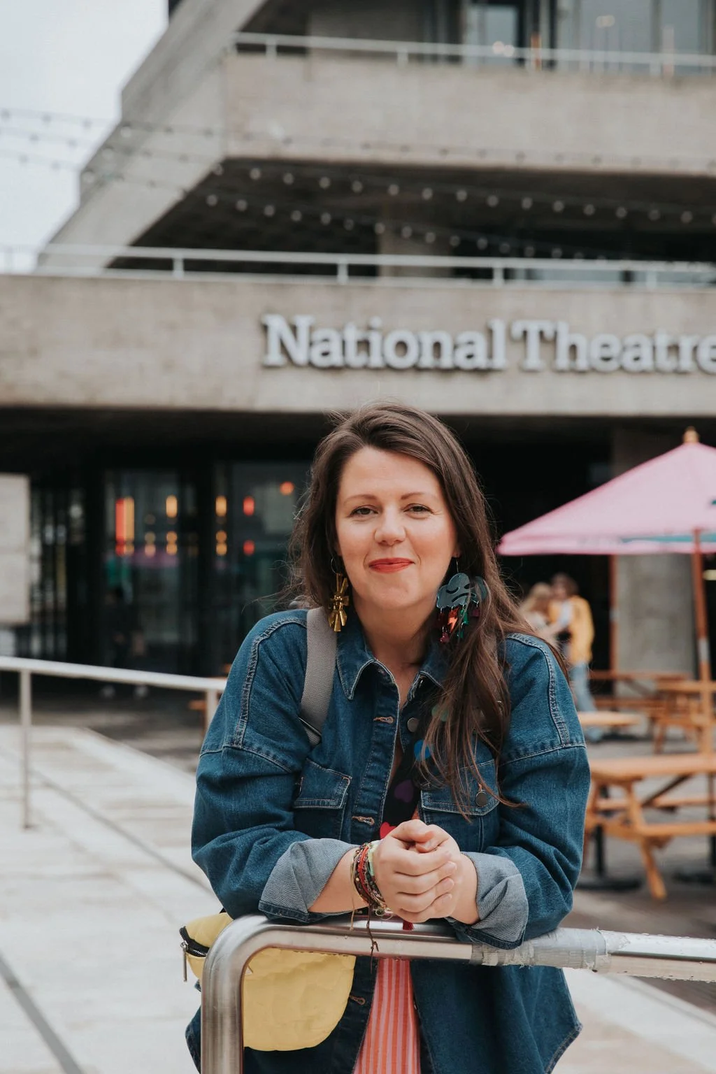 Sara Maxwell stands outside the National Theatre, a corporate client of Wealth Coach